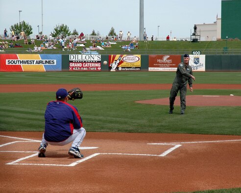 Col. William Binger, 944th Operations Group commander, throws out the first pitch at a Cactus League Spring Training baseball game March 26 in Surprise, Ariz. The Texas Rangers took on the Milwaukee Brewers at "944th Fighter Wing day" at the ballpark. More than 350 members of the 944th Fighter Wing, a reserve unit at Luke Air Force Base, Ariz., received free tickets to the game. (U.S. Air Force Reserve photo by Staff Sgt. Susan Stout)