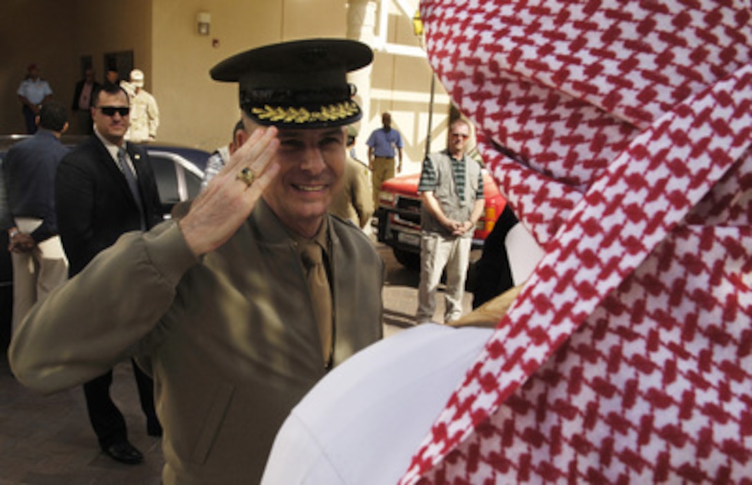 Chairman of the Joint Chiefs of Staff Gen. Peter Pace, U.S. Marine Corps, returns the salute of a Saudi Arabian soldier as he departs Riyadh, Saudi Arabia, for Turkey on March 23, 2006. Pace was in Saudi Arabia to confer with civilian and military leaders. 