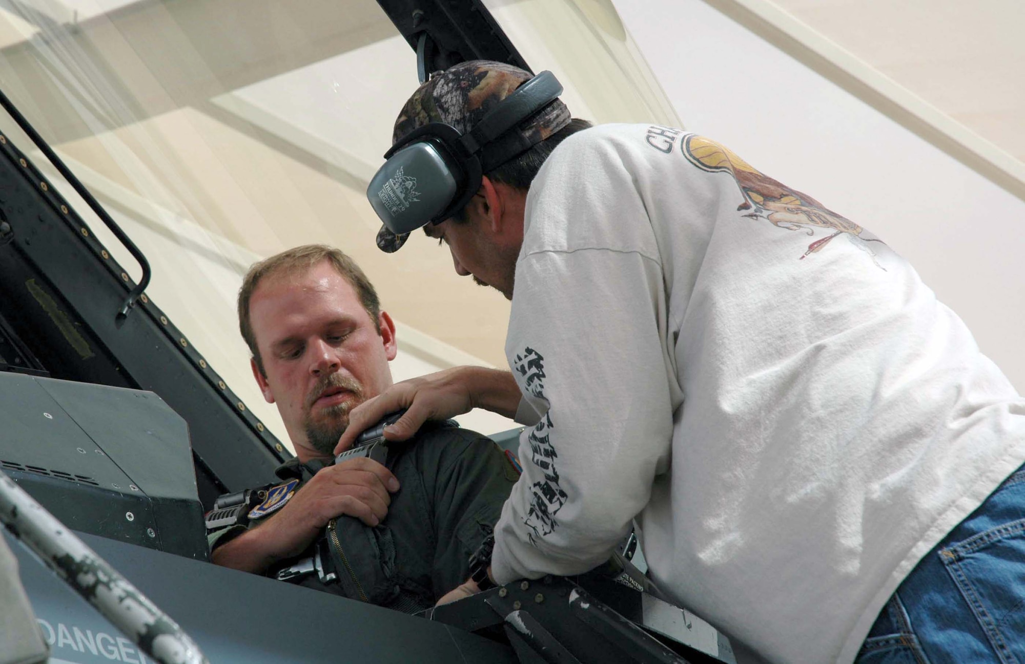 Joe Baker, 302nd Fighter Squadron life support technician, straps in Kevin Millwood, pitcher for the Texas Rangers, during an orientation flight March 28. Mr. Millwood was selected All-Star in 1999 and in December 2005 was signed to the Rangers in a four-year, $48 million contract. (U.S. Air Force Reserve photo by Staff Sgt. Susan Stout)