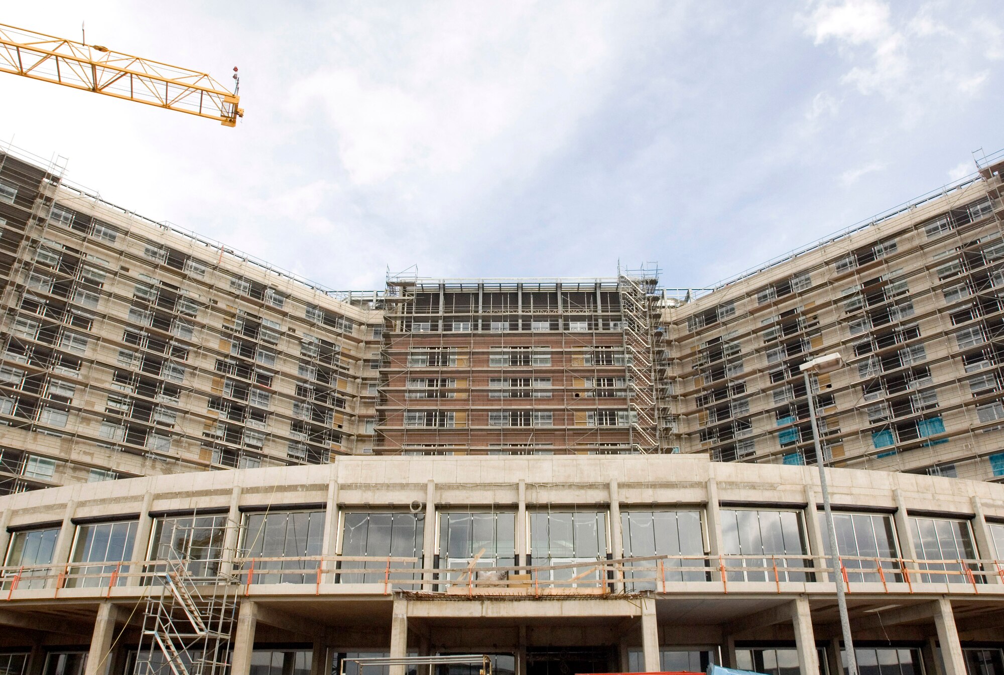 The yet unfinished hotel stands tall over the Kaiserslautern Military Community Center's construction site and Ramstein Air Base, Germany, on Tuesday, March 28, 2006. The 350-room billeting is slated to open in September and the shopping mall in early 2007. (U.S. Air Force photo/Master Sgt. John E. Lasky)
