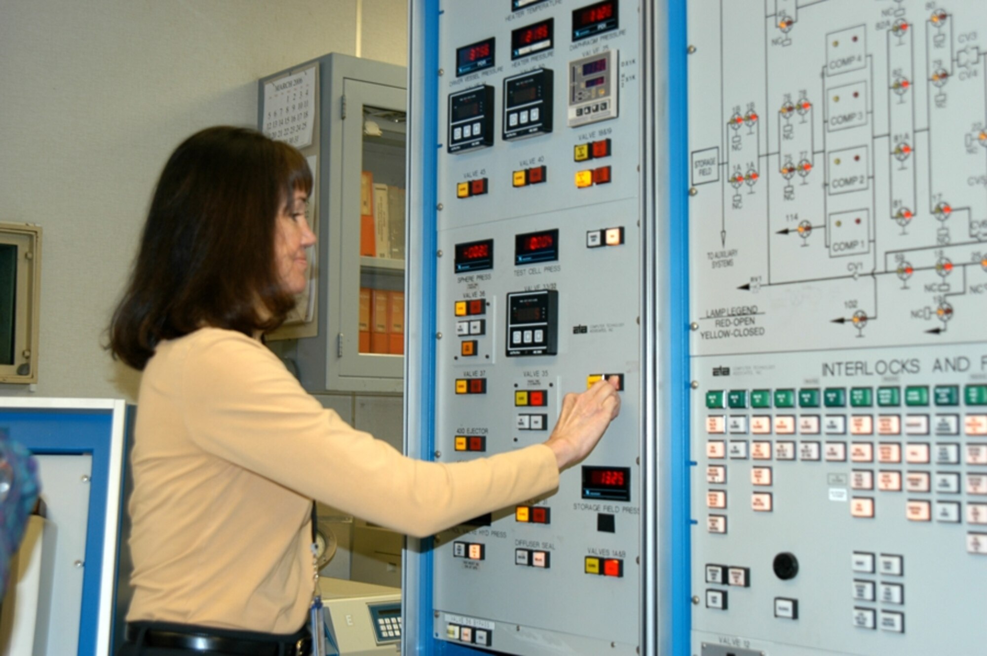 ARNOLD AIR FORCE BASE, Tenn. — Rita Bell, Tunnel 9 employee, “pushes the button” for the 3000th run at Tunnel 9. Ms. Bell was present during the facility’s first run in 1976. (Air Force photo)

