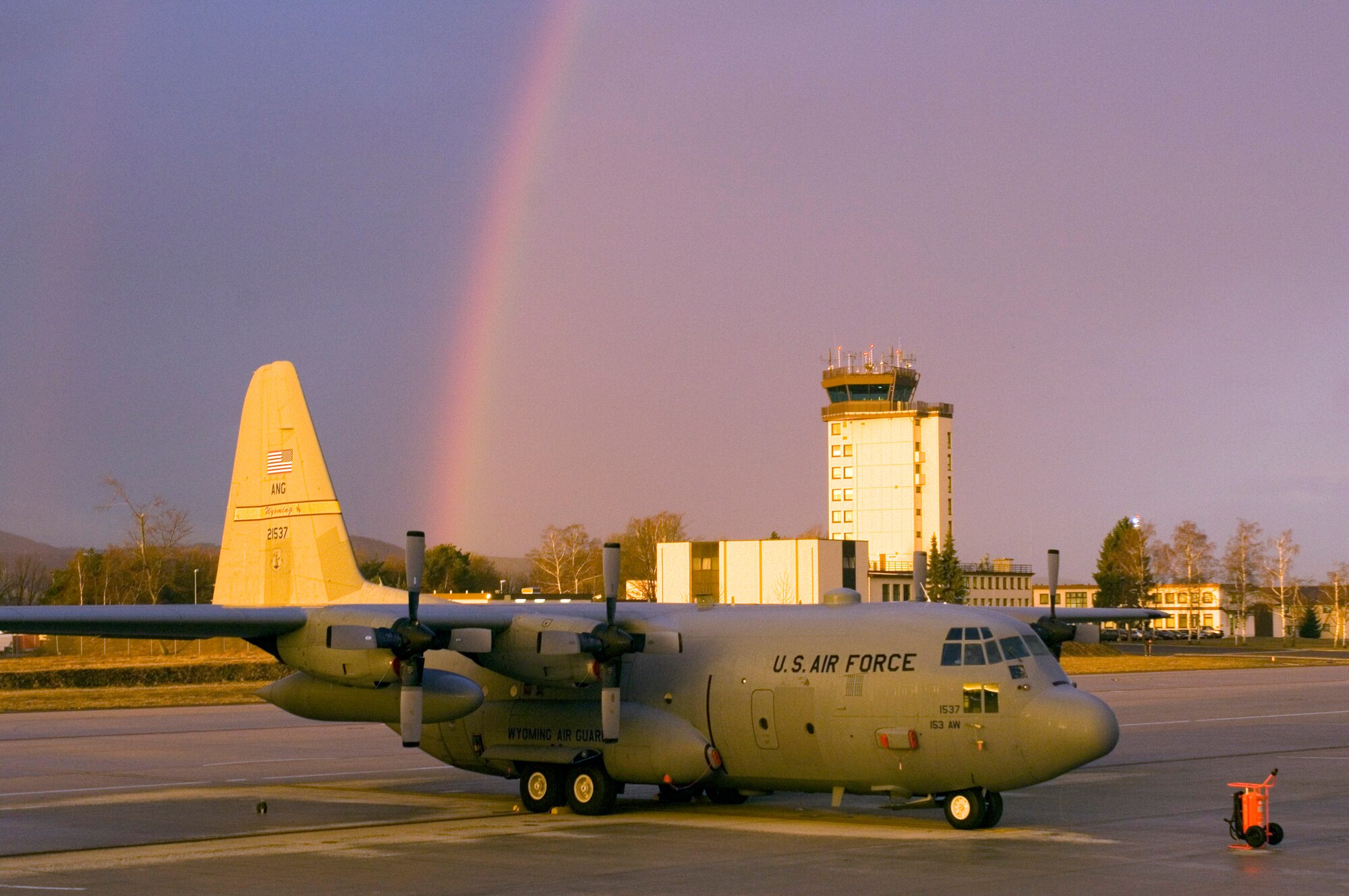 A rainbow appears over a C-130 Hercules and the air traffic control tower at Ramstein Air Base, Germany, on Monday, March 27, 2006. The air transport aircraft belongs to the 187th Airlift Squadron of the Wyoming Air National Guard in Cheyenne. (U.S. Air Force photo/Master Sgt. John E. Lasky)