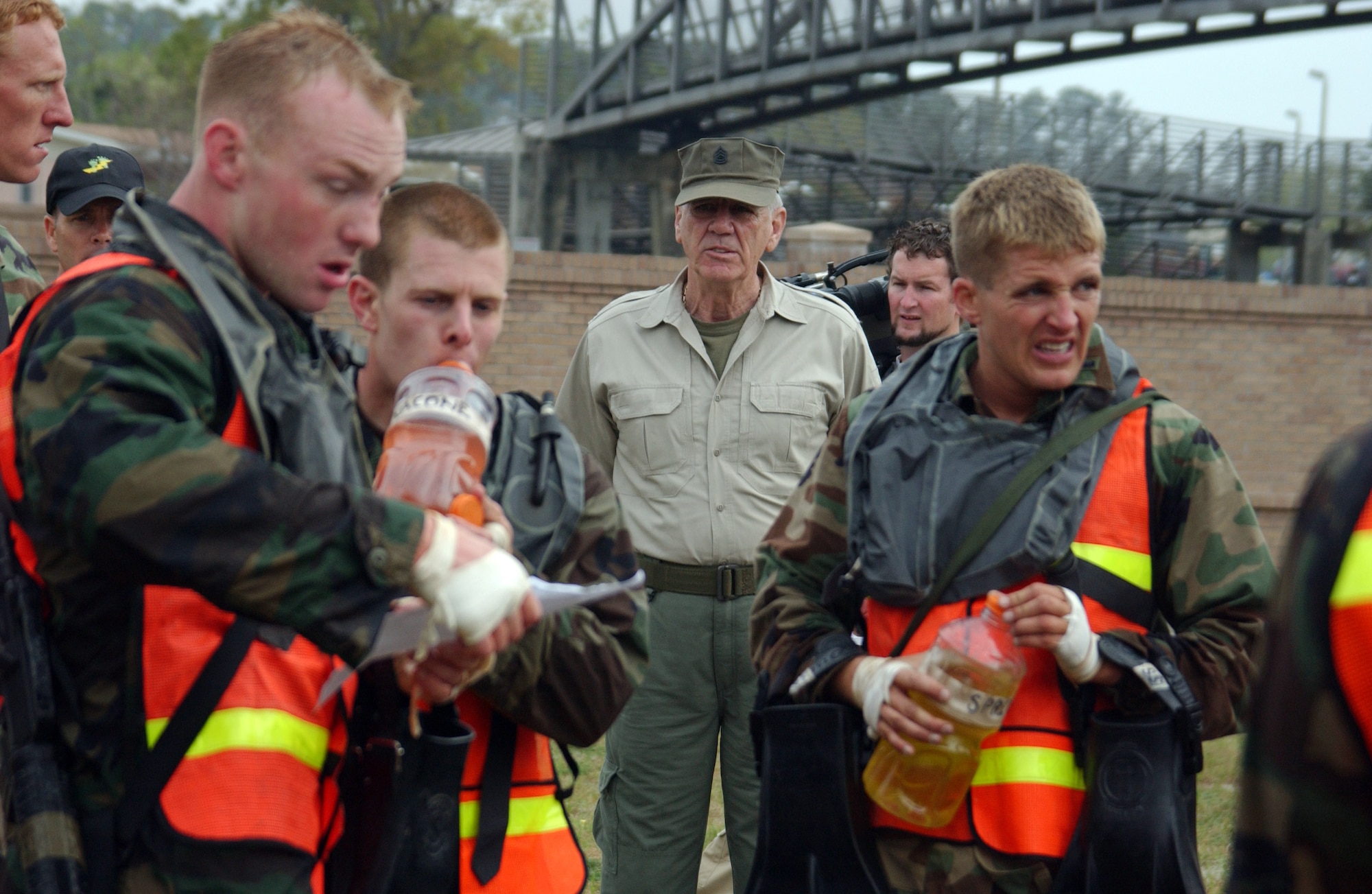 R. Lee Ermey, host of the "Mail Call" military technology show, watches as Special Tactics Officer selection course candidates read their next challenge during the "Monster Mash," a grueling exercise that tests a canadidate's physical and mental toughness at Hurlburt Field, Fla., Monday, March 20, 2006. "Gunny" Ermey was at Hurlburt to film an upcoming episode of the show focusing on Air Force Special Operations Command. He is known for his role as a tough-as-nails drill instructor in the film "Full Metal Jacket." (U.S. Air Force photo/Chief Master Sgt. Gary Emery)