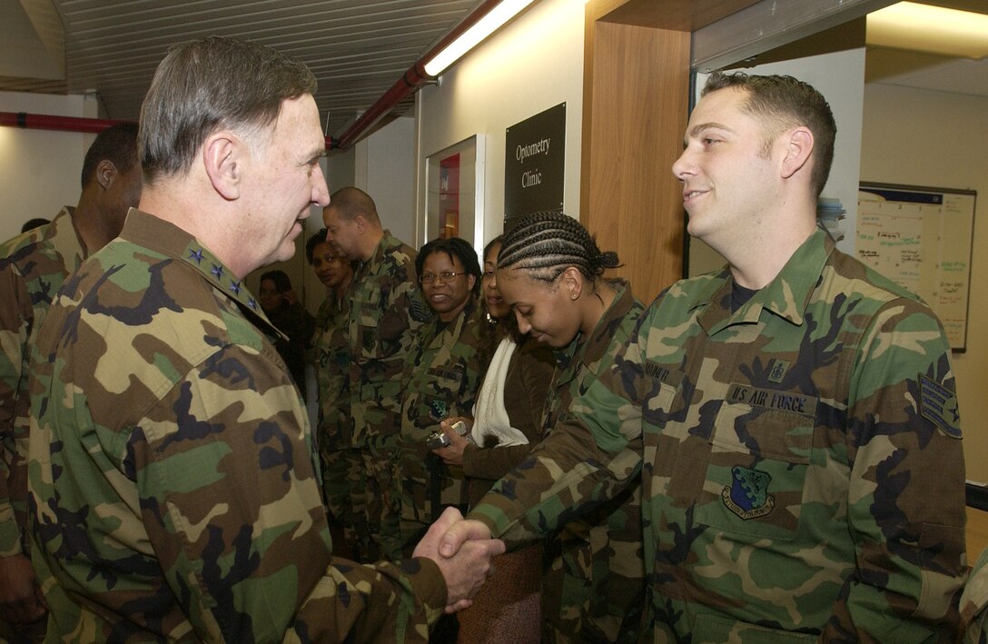 Staff Sgt. Nathan Mainer, 31st Medical Group, welcomes Gen. William Hobbins, U.S. Air Forces in Europe commander, to the Aviano medical facility March 20. General Hobbins was here to visit with Aviano Airmen, and thank them for their service. (U.S. Air Force photo by Airman Liliana Moreno)