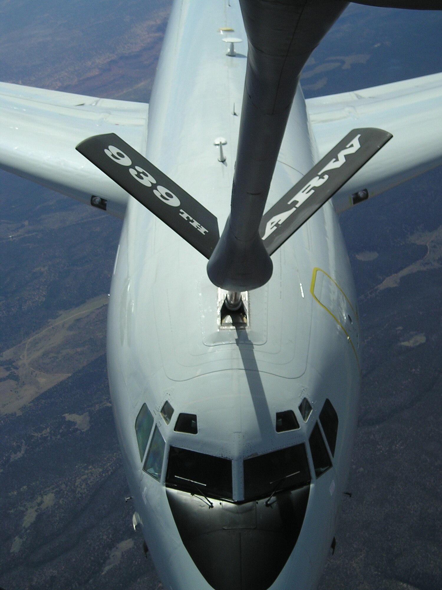 A KC-135 Stratotanker from the 939th Air Refueling WIng refuels an E-3 Sentry Airborne Warning and Control System.   The E-3 contains a radar subsystem that permits surveillance from the earth's surface up into the stratosphere, over land or water. The radar has a range of more than 200 miles for low-flying targets and farther for aerospace vehicles flying at medium to high altitudes. (U.S. Air Force Photo By Tech. Sgt. Gregory Guant)