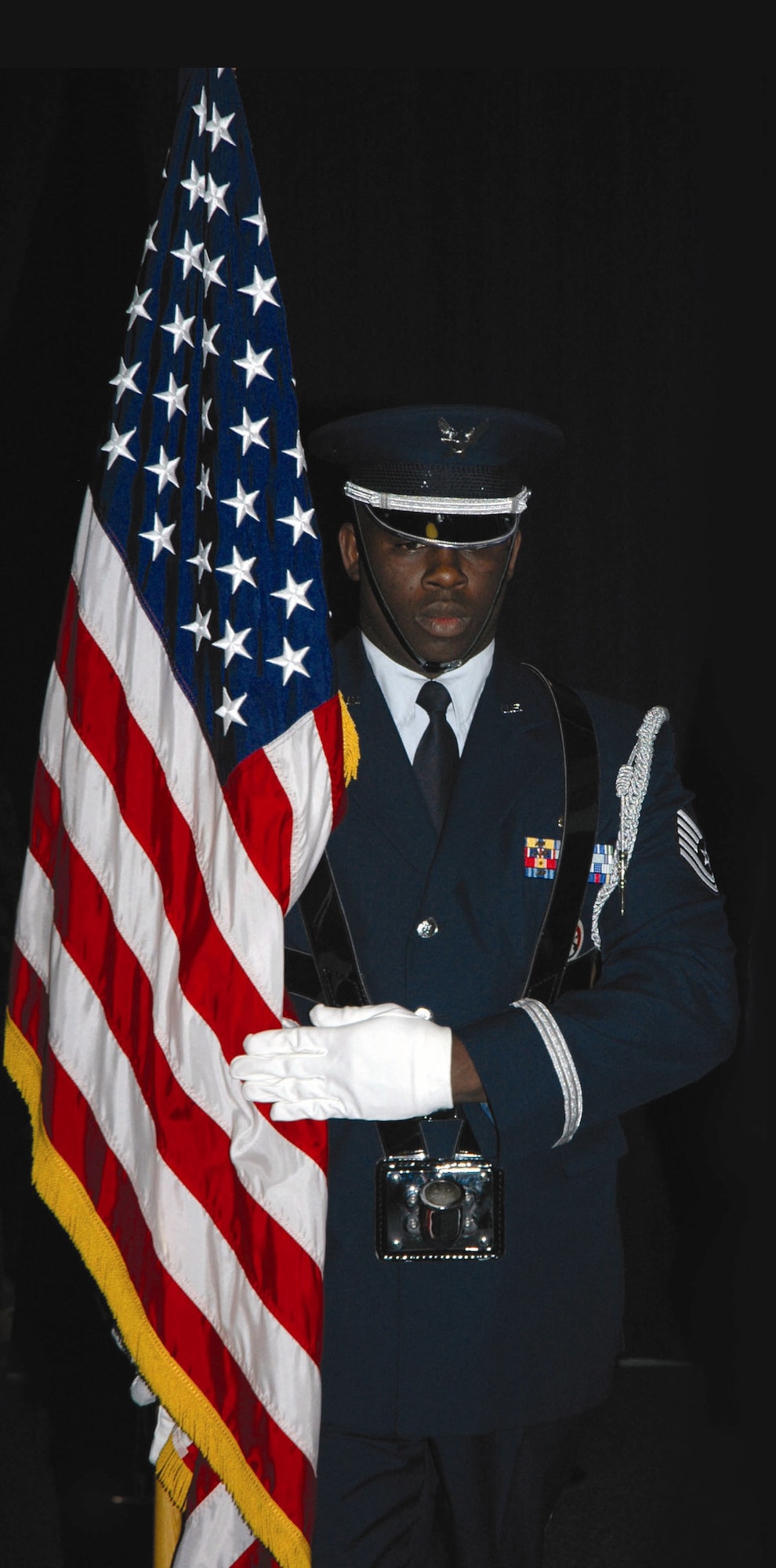 Tech. Sgt. Acy Willis, Honor Guard NCO in charge and 512th Maintenance Operations Flight member, posts the colors at a squadron change of command. He is a reservist with the 512th Airlift Wing, Dover Air Force Base, Del.