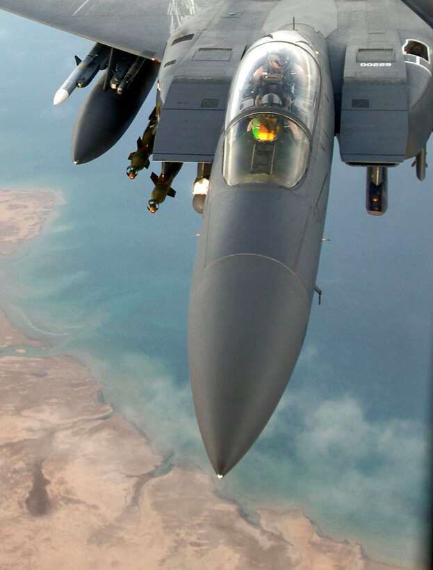 An F-15E Strike Eagle flies over a forward-deployed location in Southwest Asia. Aircraft like this are capable of monitoring the battlespace with their targeting pods. This concept is known as non-traditional intelligence, surveillance and reconnaissance. (U.S. Air Force photo/Master Sgt. Lance Cheung)