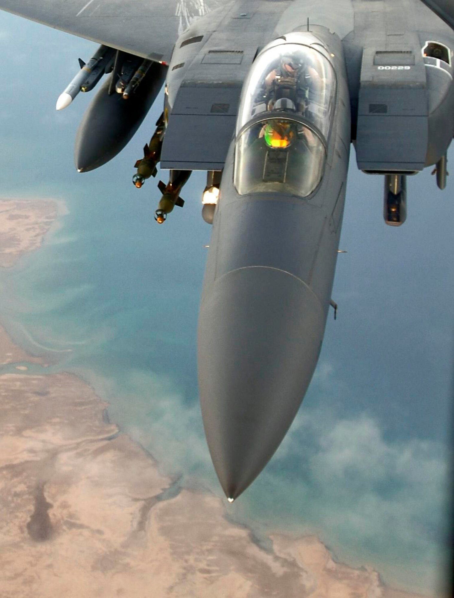 An F-15E Strike Eagle flies over a forward-deployed location in Southwest Asia. Aircraft like this are capable of monitoring the battlespace with their targeting pods. This concept is known as non-traditional intelligence, surveillance and reconnaissance. (U.S. Air Force photo/Master Sgt. Lance Cheung)