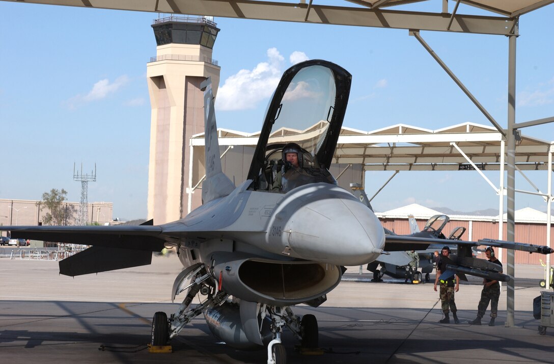 Major Rod Gard, 301st Fighter Squadron assistant director of operations, checks the gauges of a 61st Fighter Squadron F-16 before taking off. Major Gard is just one of more than 50 Reservists flying with active-duty squadrons in support of the Associate Instructor Pilot Program. (U.S. Air Force photo by Senior Airman Christopher Hummel)                            