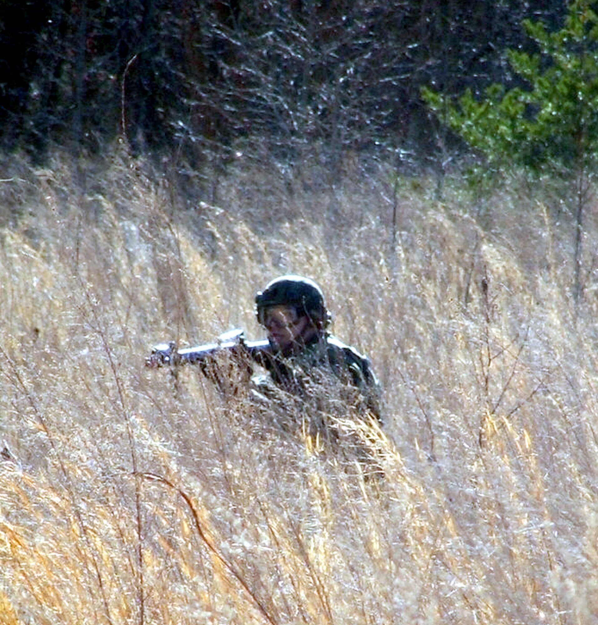 Senior Airman Adam Guerrero practices combat tactics and squad patrolling maneuvers during the Air Force Integrated Contingency Skills Training Course 06-3, at Fort Dix, N.J., on Monday, March 27, 2006.  More than 140 deploying Airmen are training in combat tactics and convoy operations, conducted by the Air Mobility Warfare Center's 421st Combat Training Squadron. Airman Guerrero is an air traffic controller from Travis Air Force Base, Calif. (U.S. Air Force photo/Tech. Sgt. Scott T. Sturkol)

