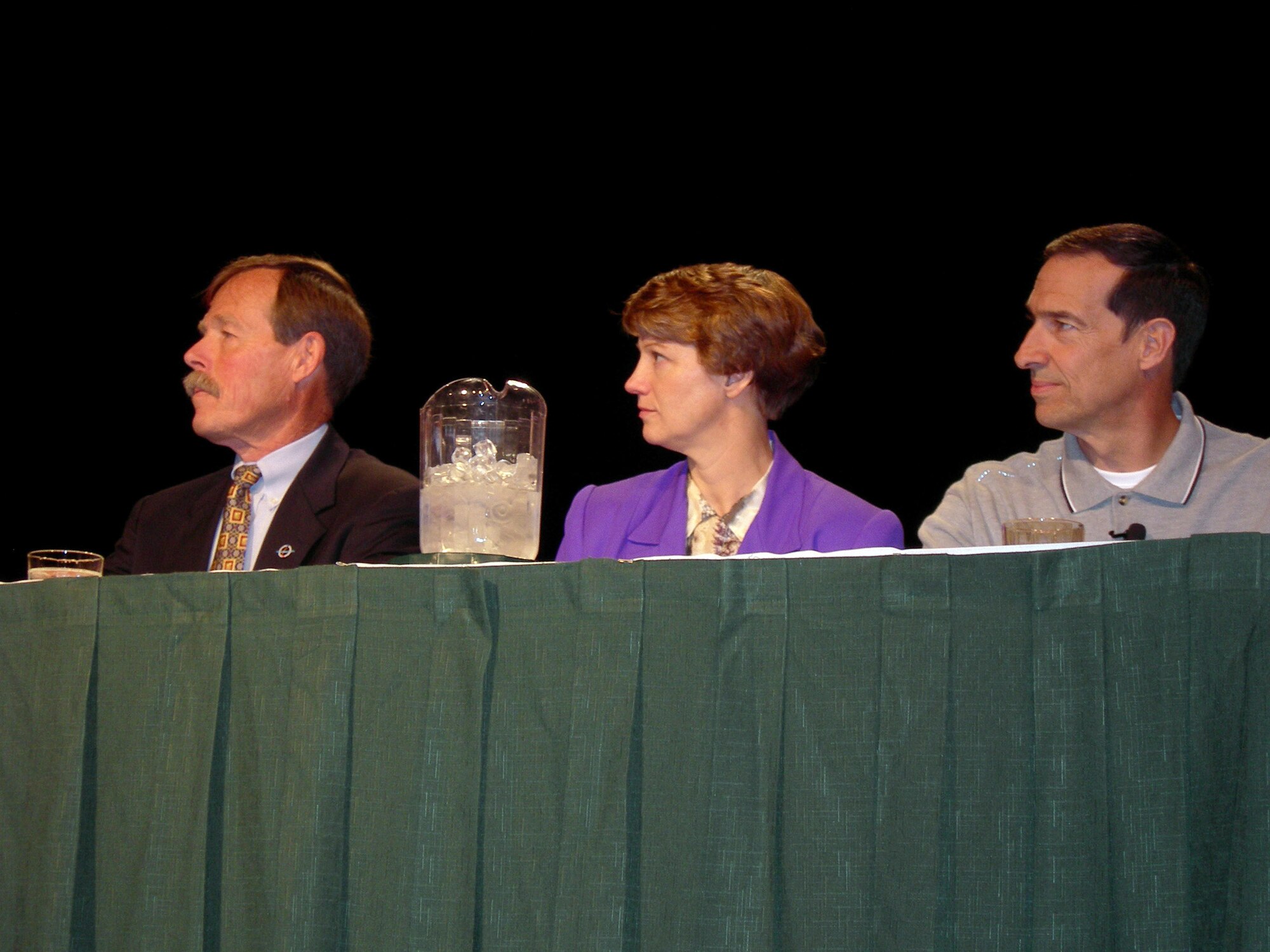 Retired Air Force Col. Eileen Collins is flanked by Robert "Hoot" Gibson, left, and Brian Binnie at the 17th International Women in Aviation Conference in Nashville, Tenn., on Saturday, March 25, 2006. (U.S. Air Force photo/Annette Crawford)