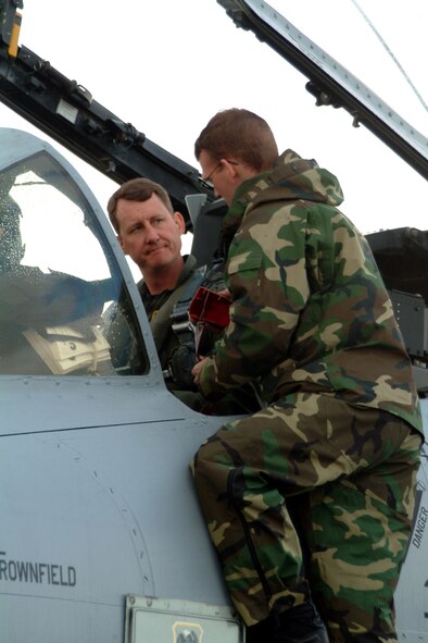 Lt. Col. Ronald Hankes, left, the flight lead for the 303rd Fighter Squadron's Hawgsmoke team for 2006, talks with crew chief, Senior Airman Steve Powell, at an exercise at McChord Air Force Base, Wash., in May 2005.  Colonel Hanks, along with team mates Lt. Col. James Mackey, Maj. Stephen Nester and Capt. Brian Leiter, brought the title of Hawgsmoke champions to the 442nd Fighter Wing at Whiteman AFB, Mo. Hawgsmoke is an A-10 bombing and gunnery competition, held every two years, to test A-10 pilots and aircraft in providing close air support. This is the first time the Air Force Reserve's 442nd FW has won the competition, which was held at Davis-Monthan AFB, Ariz., March 22 to 25.