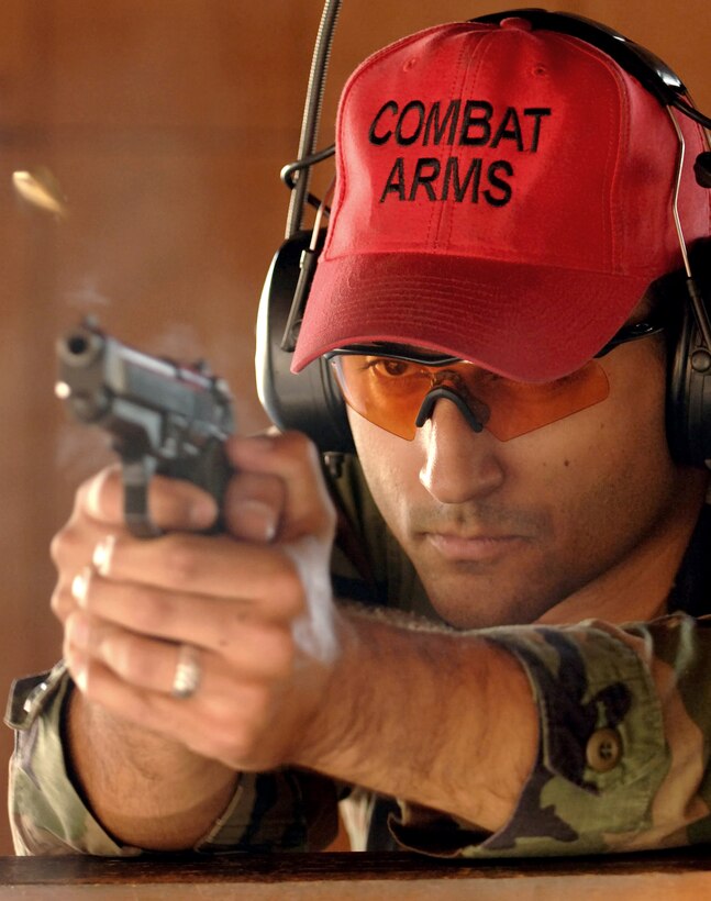 Staff Sgt. Christopher Oshana fires a Beretta M-9 pistol for proficiency training at the MacDill Air Force Base, Fla., small arms range Monday, March 27, 2006. Combat arms training and maintenance, or CATM, instructors are required to fire 500 rounds a year on each small arms weapon they teach in order to stay proficient. Sergeant Oshana is a CATM instructor with the 6th Security Forces Squadron. (U.S. Air Force photo/Senior Airman Jason P. Robertson) 