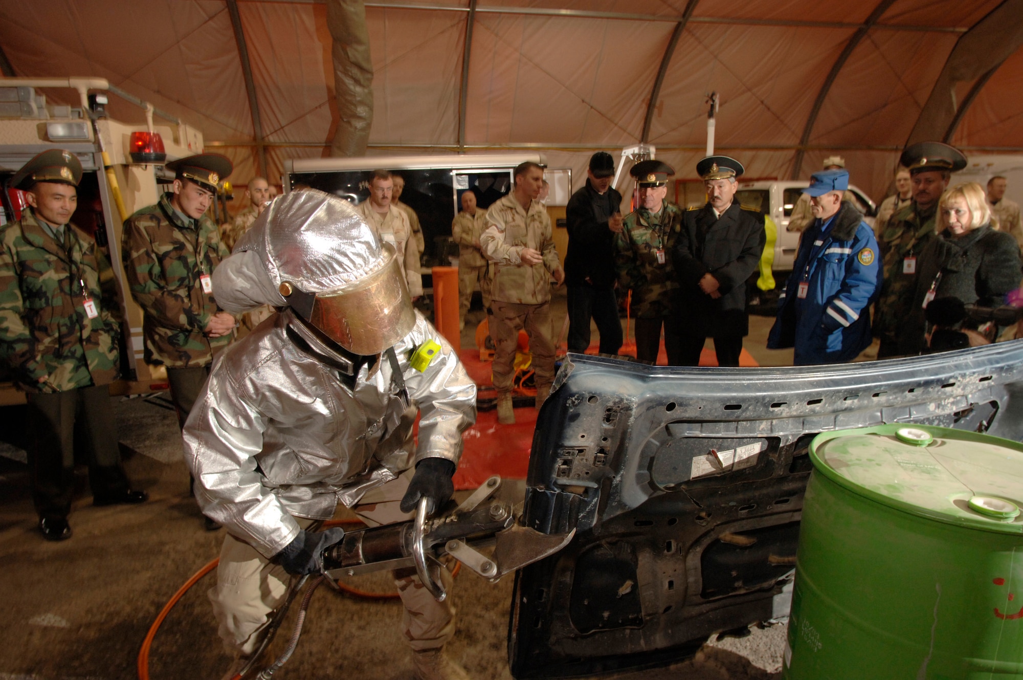 Airman 1st Class Anthony Montano demonstrates the power of the Jaws of Life during a visit by Kyrgyz emergency responders Saturday, March 18, 2006, at Manas Air Base, Kyrgyzstan. Airman Montano is deployed to the 376th Expeditionary Civil Engineer Squadron from the 22nd CES at McConnell Air Force Base, Kan. (U.S. Air Force photo/Master Sgt. Lance Cheung)