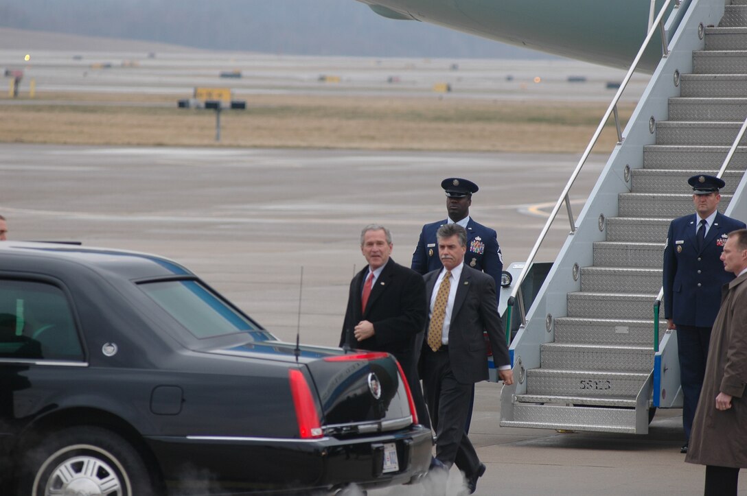 President George W. Bush proceeds to the motorcade shortly after arriving at the 911th Airlift Wing, March 24.  The president was visiting the area in order to attend a fund-raiser for Senator Rick Santorum.