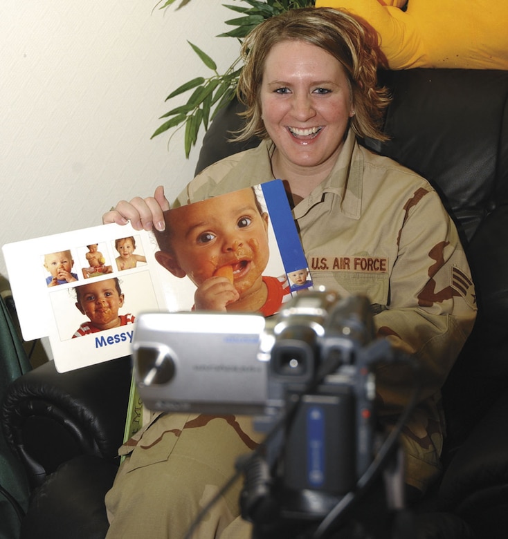 SrA. Katie Pinar takes advantage of Hearts Apart, a program that allows deployed service members to record themselves on a DVD reading a book, to keep in touch with her 2-year-old son, Zach.