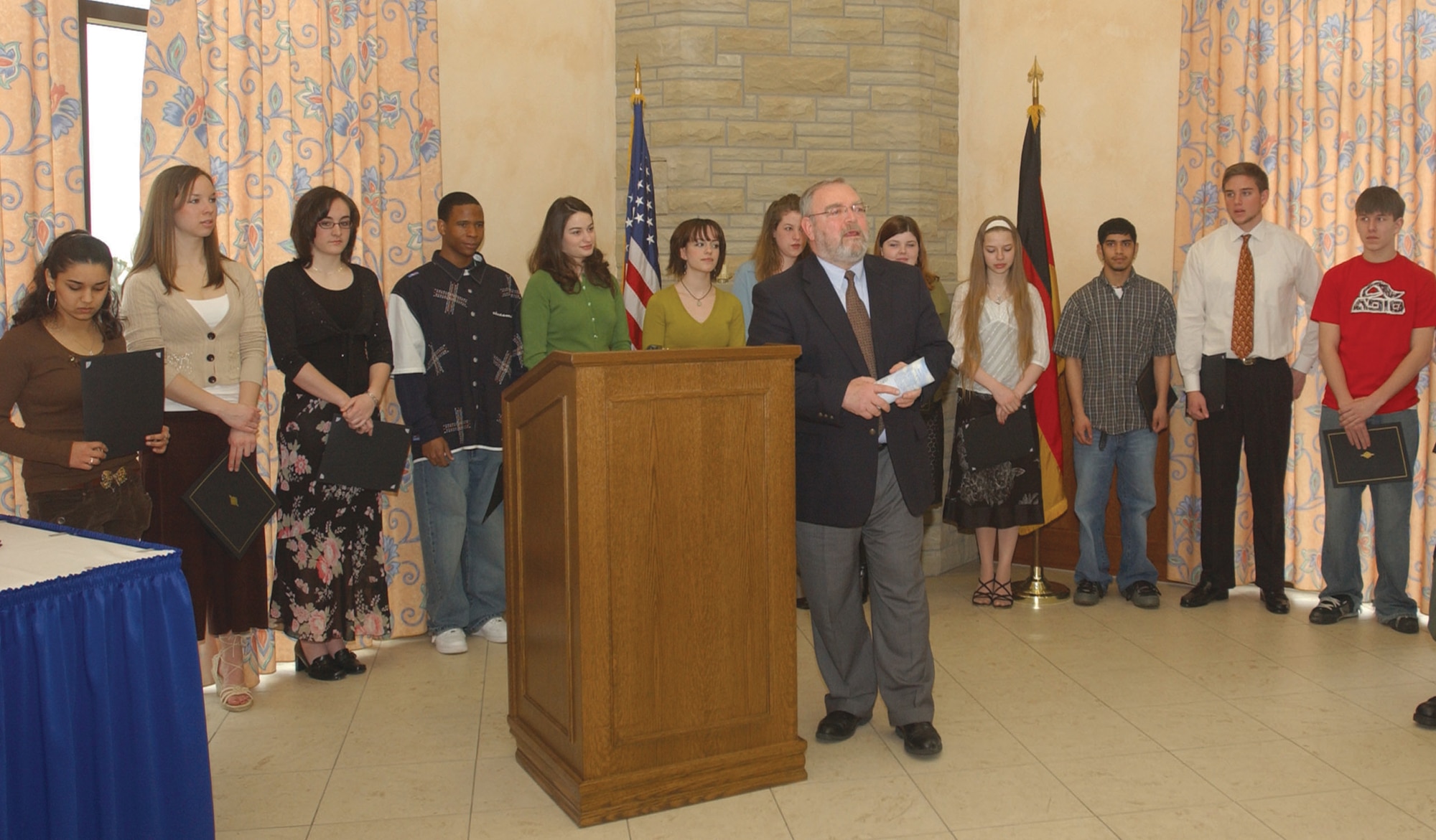 Bitburg High School Principal Robert Kubarek delivers closing remarks during the Commander's Honor Roll ceremony March 21 (U.S. Air Force photo by Airman Emily Moore).