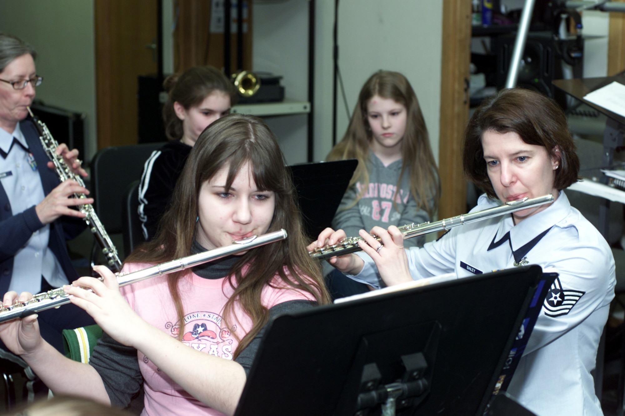 Tech. Sgt. Cindy Bailey, U.S. Air Forces in Europe Band member, and Marissa Cloum, an 11th grader with the Alconbury High School band, practice on the clarinet May 21.