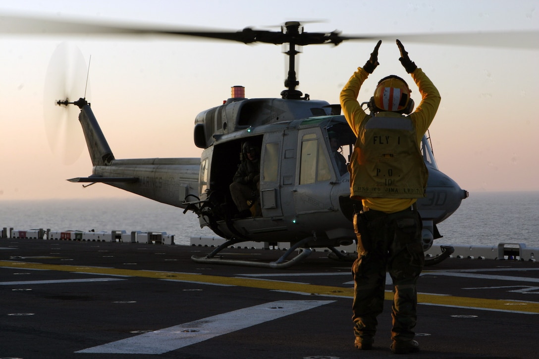 A UH-1N Huey takes-off from the USS Iwo Jima March 31, 2006, during the 24th Marine Expeditionary Unit's Expeditionary Strike Group Exercise.  Marines with Marine Medium Helicopter Squadron 365 (Reinforced) are using the exercise as an opportunity to enhance their carrier landing skills.