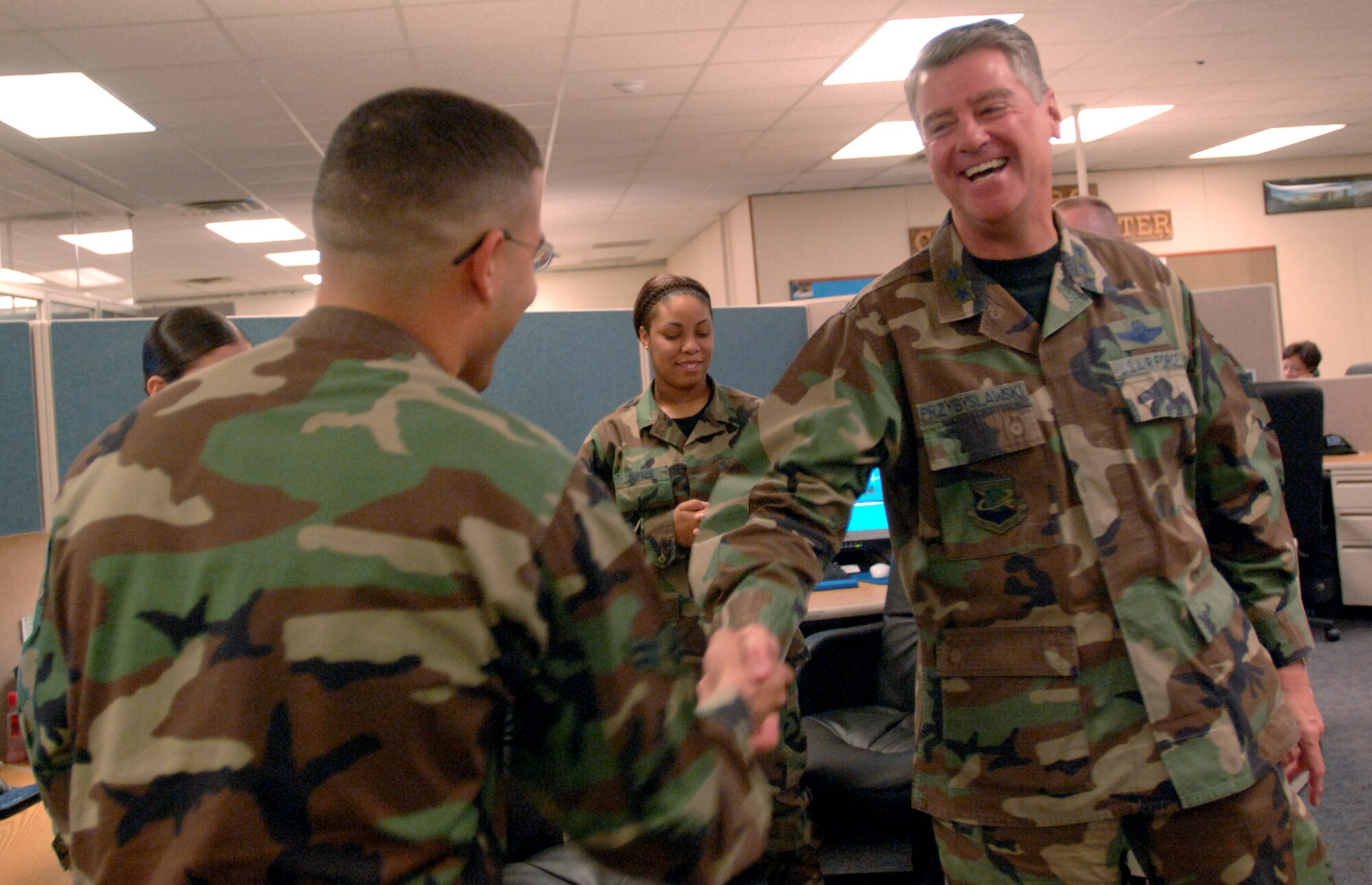 Maj. Gen. Tony Przybyslawski jokes with Airman 1st Class Emmanuel Mercado after attending the launch ceremony of the Personnel Service Delivery System, Friday, March 31, 2006, at Randolph Air Force Base, Texas. (U.S. Air Force photo/Tech. Sgt. Cecilio Ricardo Jr.)
 
