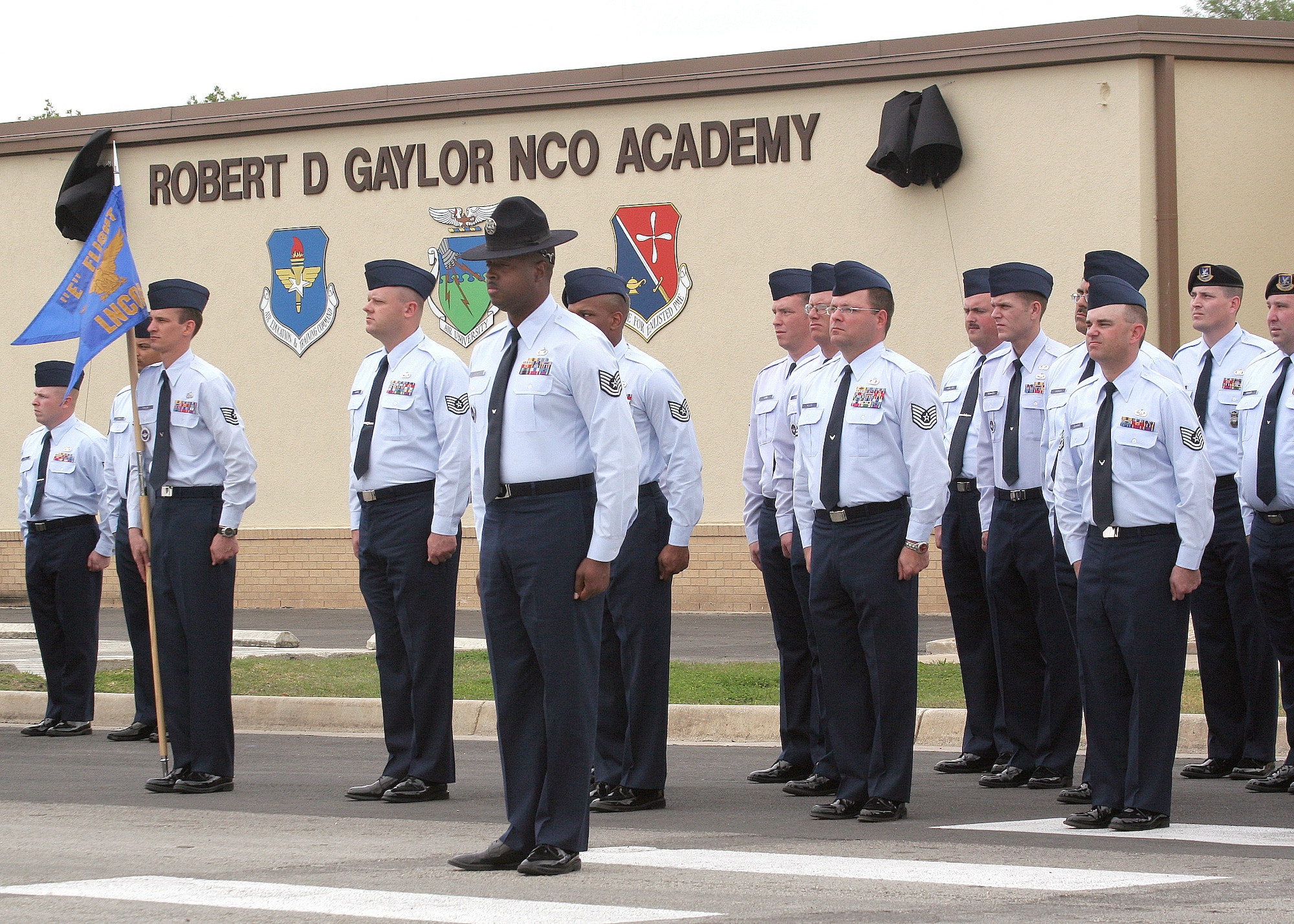 Graduating Class 06-3 "E" Flight listens to the fifth Chief Master Sergeant of the Air Force, Robert D. Gaylor, during a ceremony renaming the Lackland noncommissioned officer academy for Chief Gaylor on Thursday, March 30, 2006.  (U.S. Air Force photo/Robbin Cresswell)           