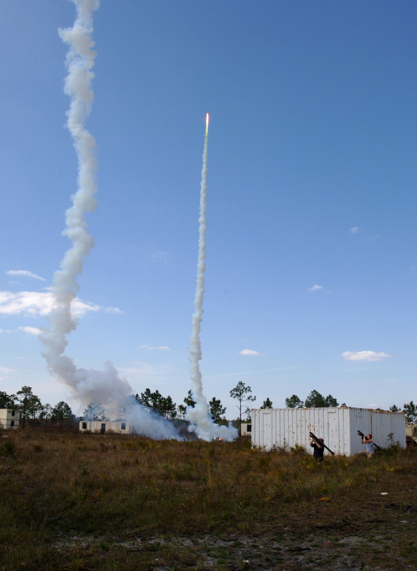 Two "aggressors" simulate firing rocket-propelled grenades at U.S. forces trying to secure a mock village, Wednesday, March 29, 2006 at Avon Park, Fla. during Atlantic Strike III, a joint air and ground training event. (U.S. Air Force photo/Staff Sgt. Ashley S. Brokop) 