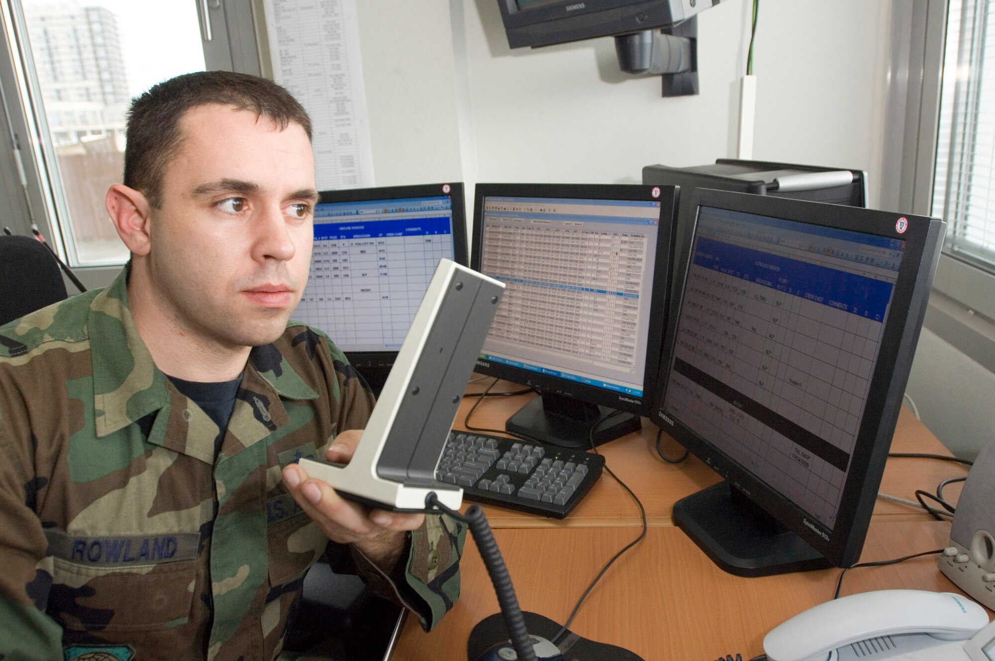 Staff Sgt. David Rowland dispatches a load team to download a C-17 Globemaster III at Ramstein Air Base, Germany, on Thursday, March 30, 2006. Sergeant Rowland, of Platte City, Mo., is a ramp services specialist with the 723rd Aircraft Maintenance Unit. (U.S. Air Force photo/Master Sgt. John E. Lasky)
