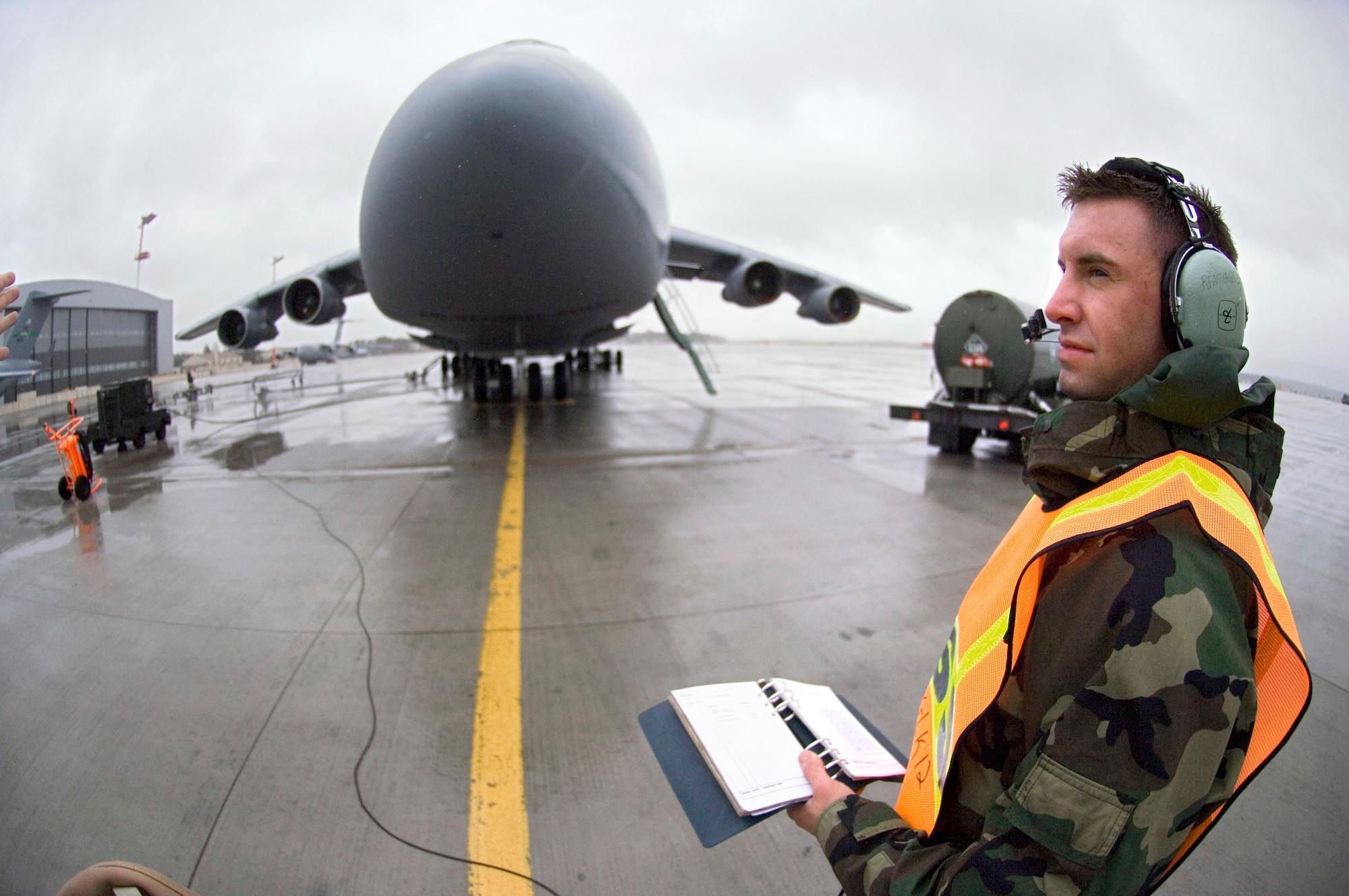 Staff Sgt. Daniel Wienfurter checks that the fuel is balanced as itUs pumped into a C-5 Galaxy at Ramstein Air Base, Germany, on Thursday, March 30, 2006. Sergeant Wienfurter, of Aurora, Wisc., is a crew chief with the 723rd Aircraft Maintenance Unit. (U.S. Air Force photo/Master Sgt. John E. Lasky)
