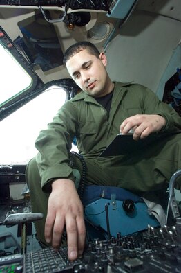 Senior Airman Aaron Ballegos runs a diagnostic check on the radio and navigation system on a C-5 Galaxy at Ramstein Air Base, Germany, on Thursday, March 30, 2006. Airman Ballegos, of Seattle, Wash., is a communications and navigations specialist with the 723rd Aircraft Maintenance Unit. (U.S. Air Force photo/Master Sgt. John E. Lasky)