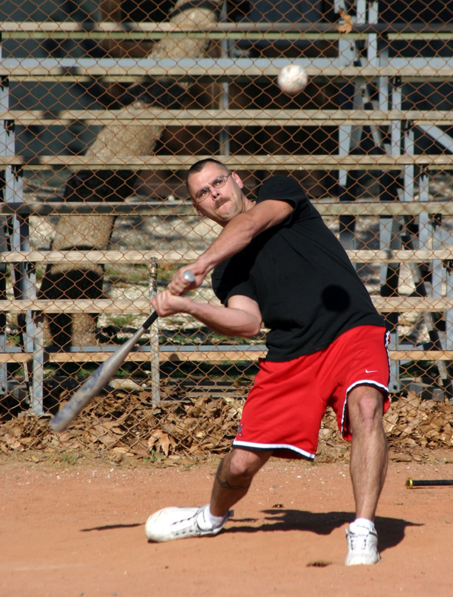 Air Force Reservist Staff Sgt. Timothy Trollope, 940th Maintenance Squadron structural maintenance technician, plays softball at Incirlik Air Base, Turkey while deployed as part of the 385th Air Expeditionary Group Dec. 11, 2005.  (U.S. Air Force Photo by 1st Lt. Michael Wimberly)