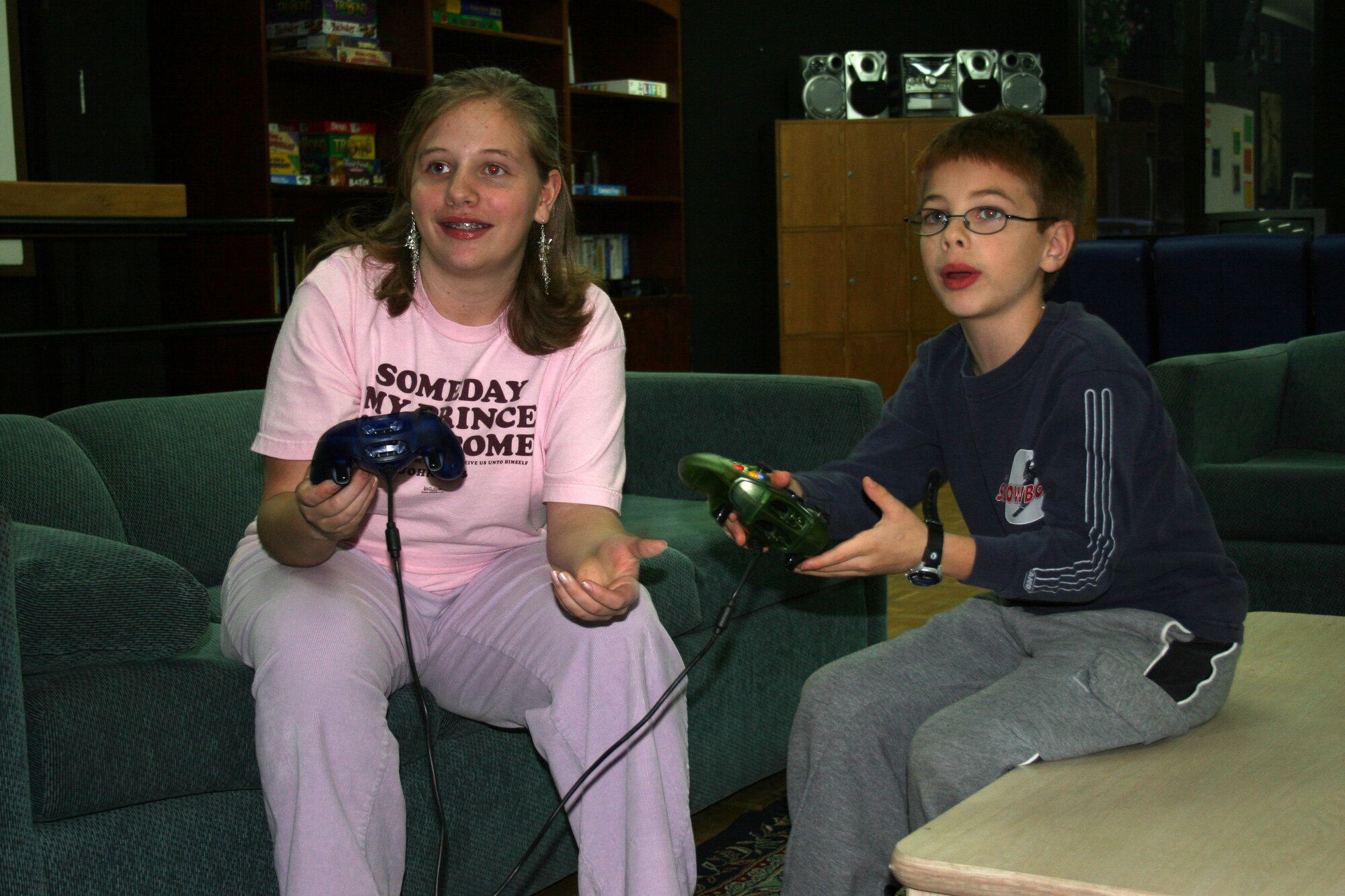 Aleta Shaheen (left) plays video games with her brother, Ian, at the youth center at Incirlik Air Base, Turkey March 16. Aleta was recently named Incirlik’s Youth of the Year. (Photo by Tech. Sgt. Brian Jones)