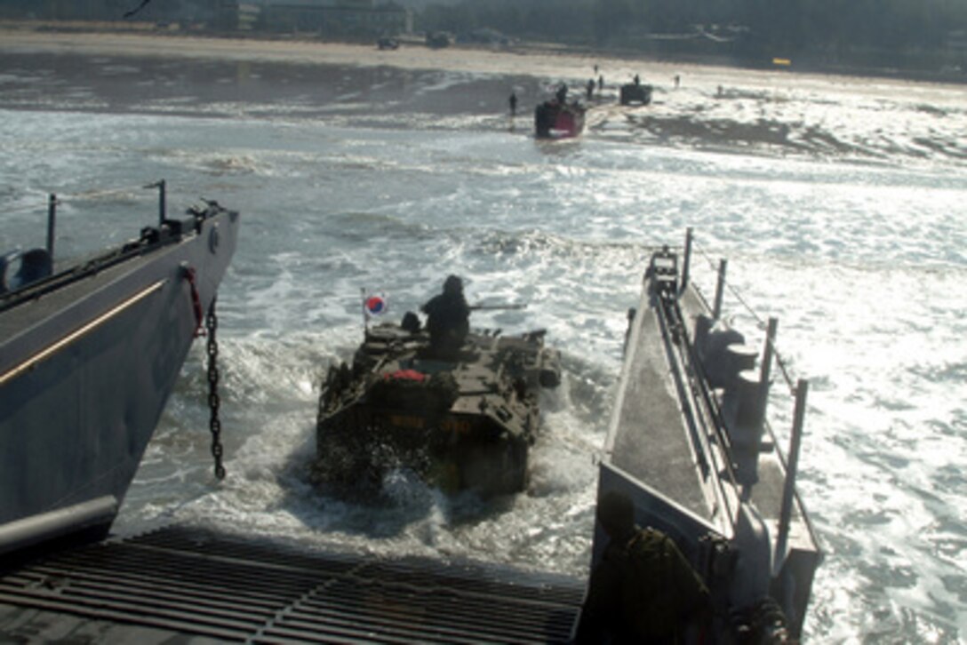 A Republic of Korea amphibious assault vehicle enters the surf from a U.S. Navy landing craft utility during an Exercise Foal Eagle combined amphibious landing in Manripo, Republic of Korea, on March 30, 2006. Foal Eagle is a joint exercise between the Republic of Korea and the U.S. Armed Forces designed to enhance war-fighting skills. 