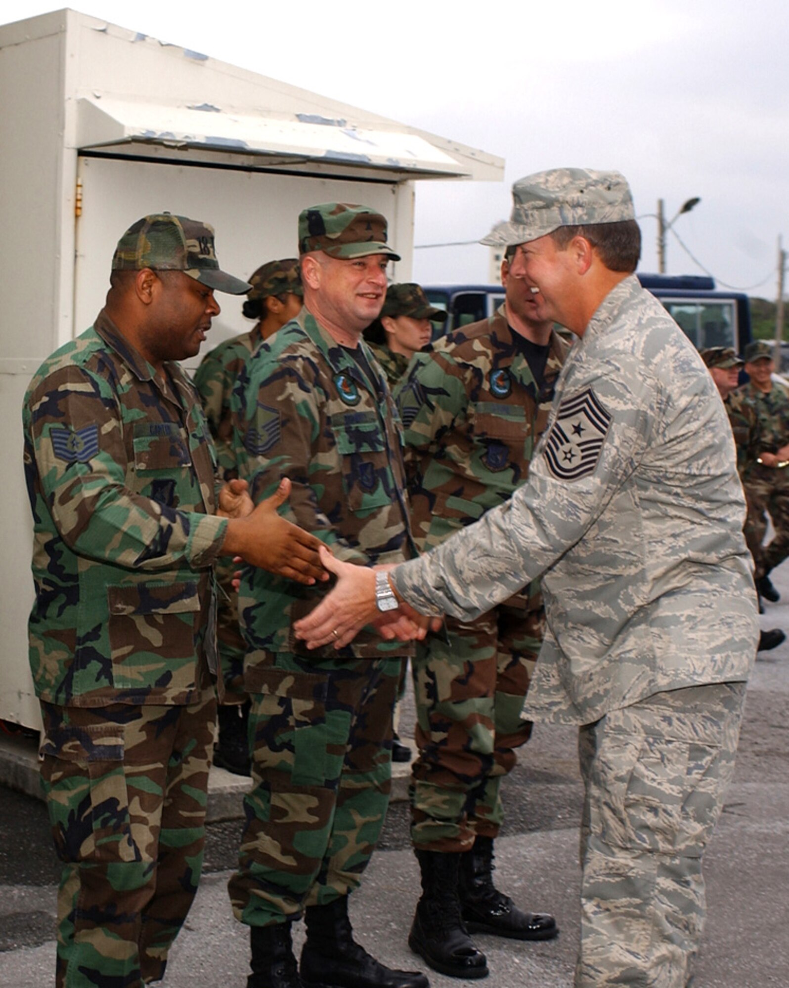 Chief Master Sgt. Rodney J. McKinley, shown here shaking hands with Airmen, has been selected as the 15th chief master sergeant of the Air Force by Air Force Chief of Staff Gen. T. Michael Moseley.  He will replace Chief Master Sgt. of the Air Force Gerald R. Murray on July 1, following Chief Murray's retirement June 30.  Chief McKinley currently serves as the command chief master sergeant for Pacific Air Forces.  (U.S. Air Force photo)
