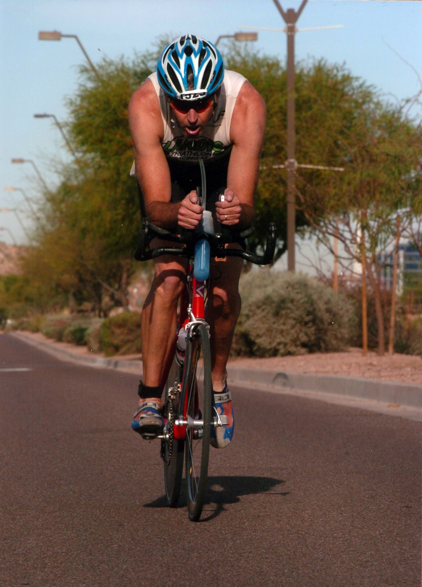 Lt. Col. Geoff Cleveland, 301st Fighter Squadron, rides his bike at the 2006 Ironman Triathlon in Tempe Town Center April 9. (Courtesy photo)