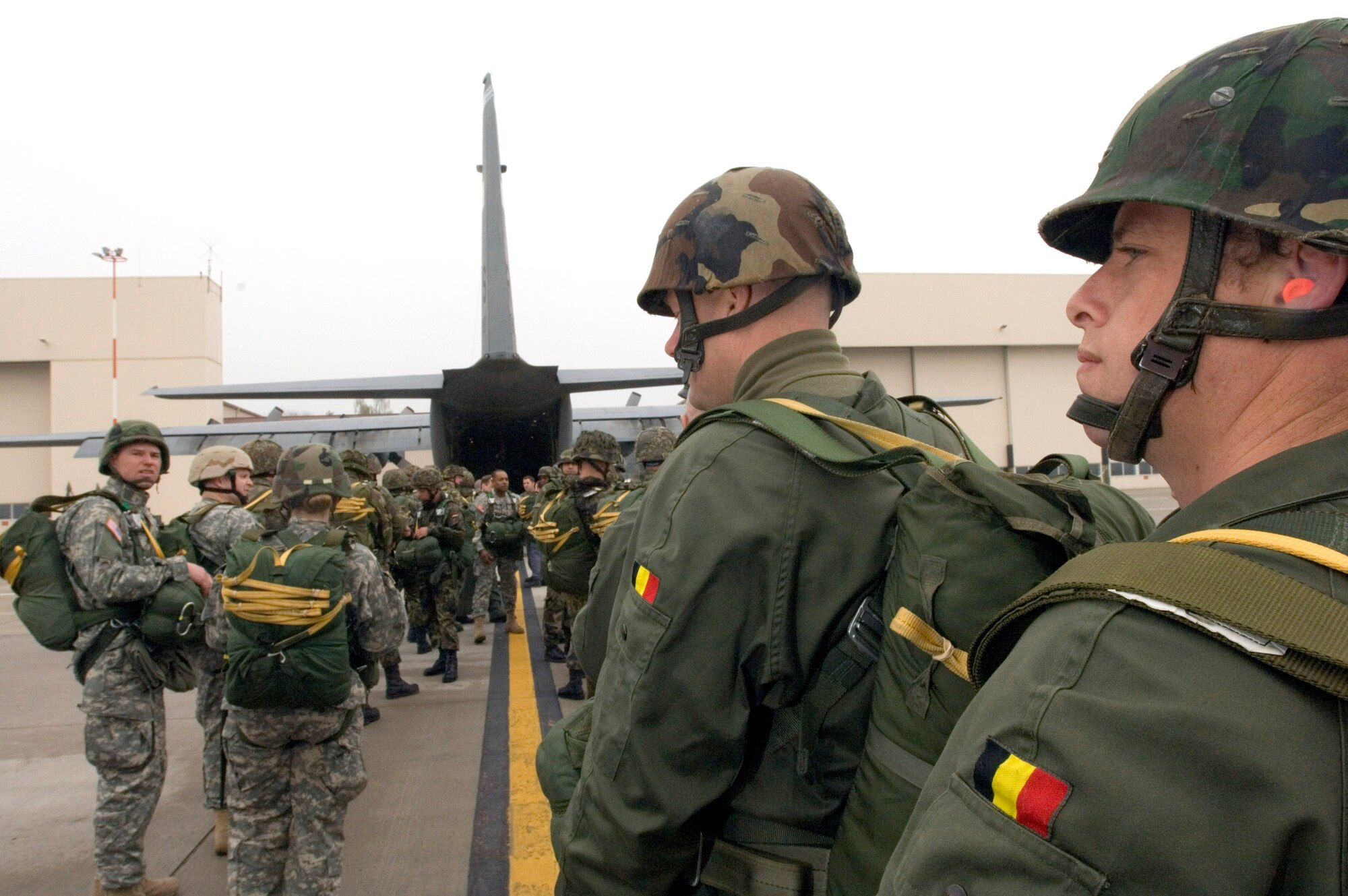 Paratroopers from the United States, Belgium, France, Germany, Italy and the Netherlands board a C-130 Hercules at Ramstein Air Base, Germany, on Thursday, April 27, 2006. Three days of jumps were scheduled using air transports from the 37th Airlift Squadron. (U.S. Air Force photo/Master Sgt. John E. Lasky) 