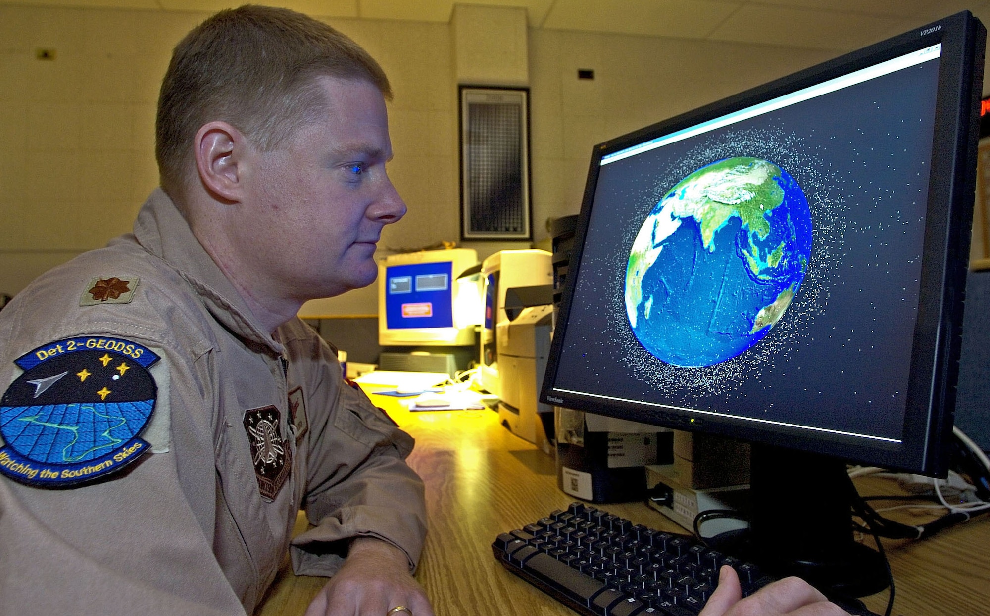 Maj. Jay Fulmer uses space and missile analysis software to track known man-made deep space objects in orbit around Earth. Major Fulmer is commander of Detachment 2 of the Ground-Based Electro-Optical Deep Space Surveillance System in Southwest Asia. (U.S. Air Force photo/Senior Master Sgt. John Rohrer)
