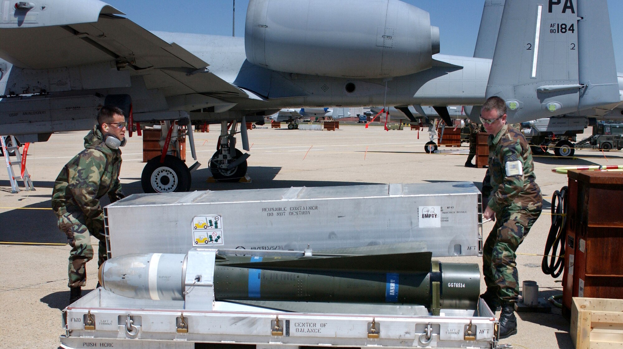 Senior Airman Daniel Bonora (left) and Tech. Sgt. Scott Edsell uncrate an AGM 65 Maverick missile during the first phase of an operational readiness inspection at Willow Grove Air Reserve Station, Pa., on Saturday, April 29, 2006. Airman Bonora and Sergeant Edsell are with the Pennsylvania Air National Guard's 111th Maintenance Squadron. (U.S. Air Force photo/Staff Sgt. Marie Harmon)                              