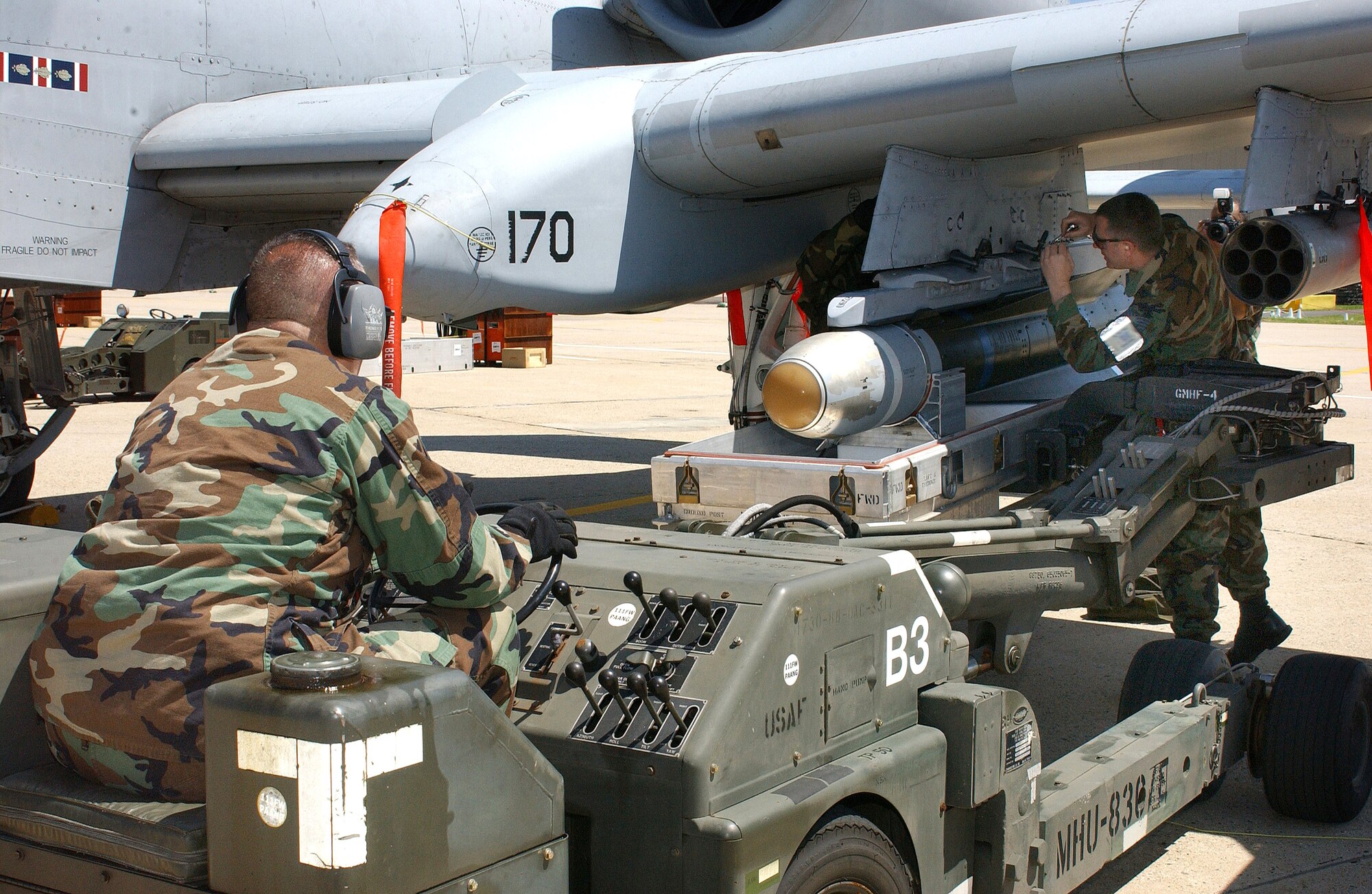 Tech. Sgts. Bruce Hart (left) and Scott Edsell secure an AGM 65 Maverick missile to an A-10 Thunderbolt II during the first phase of an operational readiness inspection at Willow Grove Air Reserve Station, Pa., on Saturday, April 29, 2006. Sergeants Hart and Edsell are with the Pennsylvania Air National Guard's 111th Maintenance Squadron. (U.S. Air Force photo/Staff Sgt. Marie Harmon)