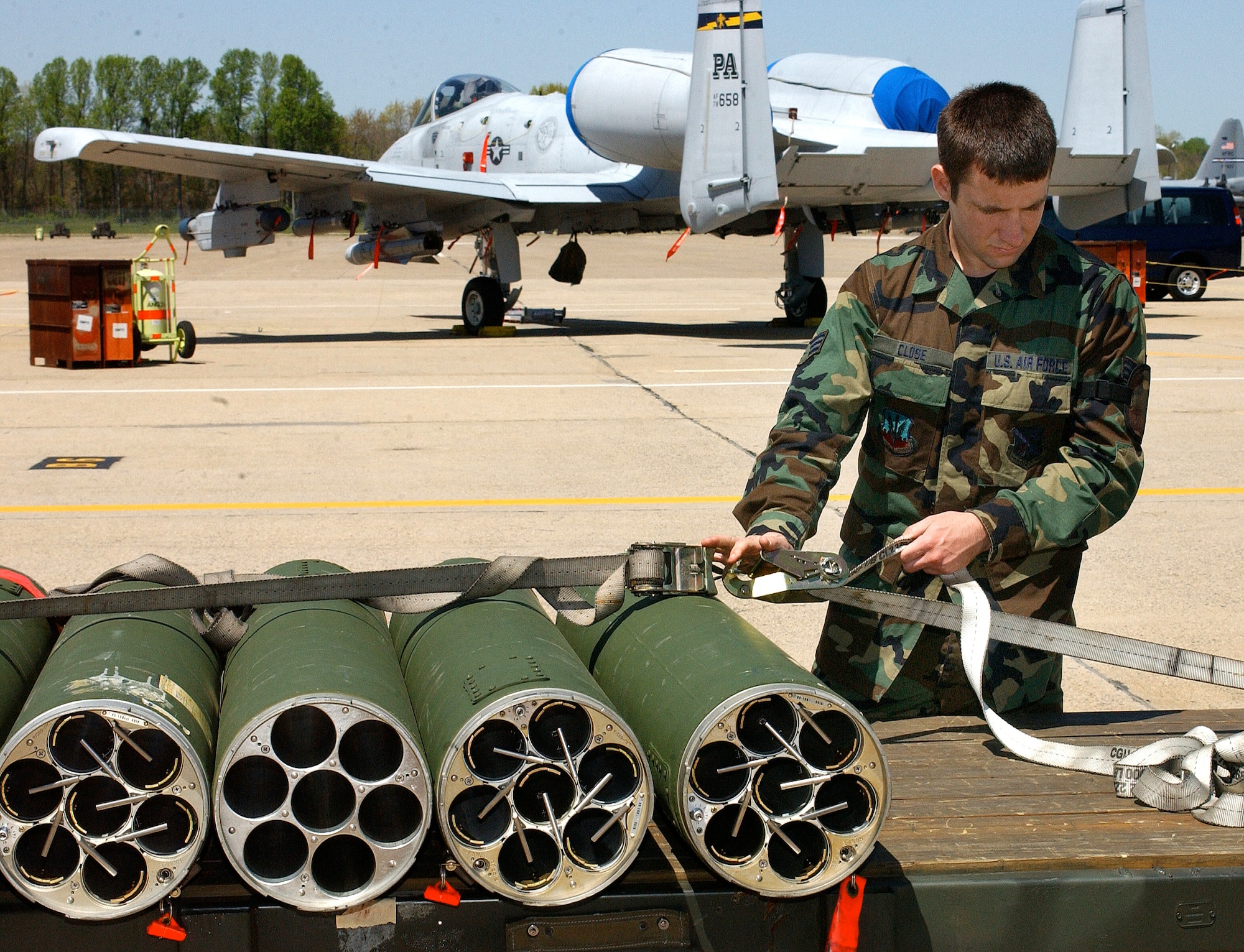 Senior Airman Stephen Close secures rocket housings on a trailer during the first phase of an operational readiness inspection at Willow Grove Air Reserve Station, Pa., on Saturday, April 29, 2006. Airman Close is with the Pennsylvania Air National Guard's 111th Maintenance Squadron. (U.S. Air Force photo/Staff Sgt. Marie Harmon)
                      