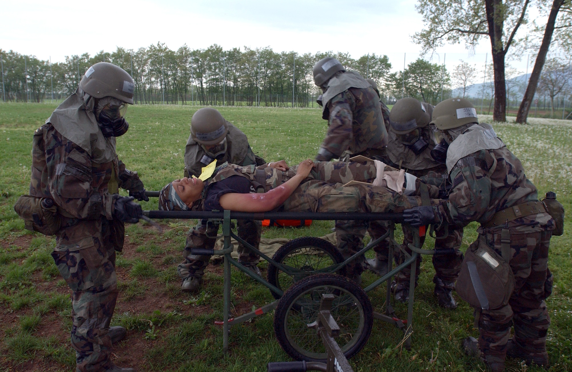 Airmen from the 31st Medical Group at Aviano Air Base, Italy, go through an exercise scenario during combat medical readiness training on Thursday, April 27, 2006. The training prepares Airmen for deployments and rapid response in emergency situations. (U.S. Air Force photo/Airman Liliana Moreno) 