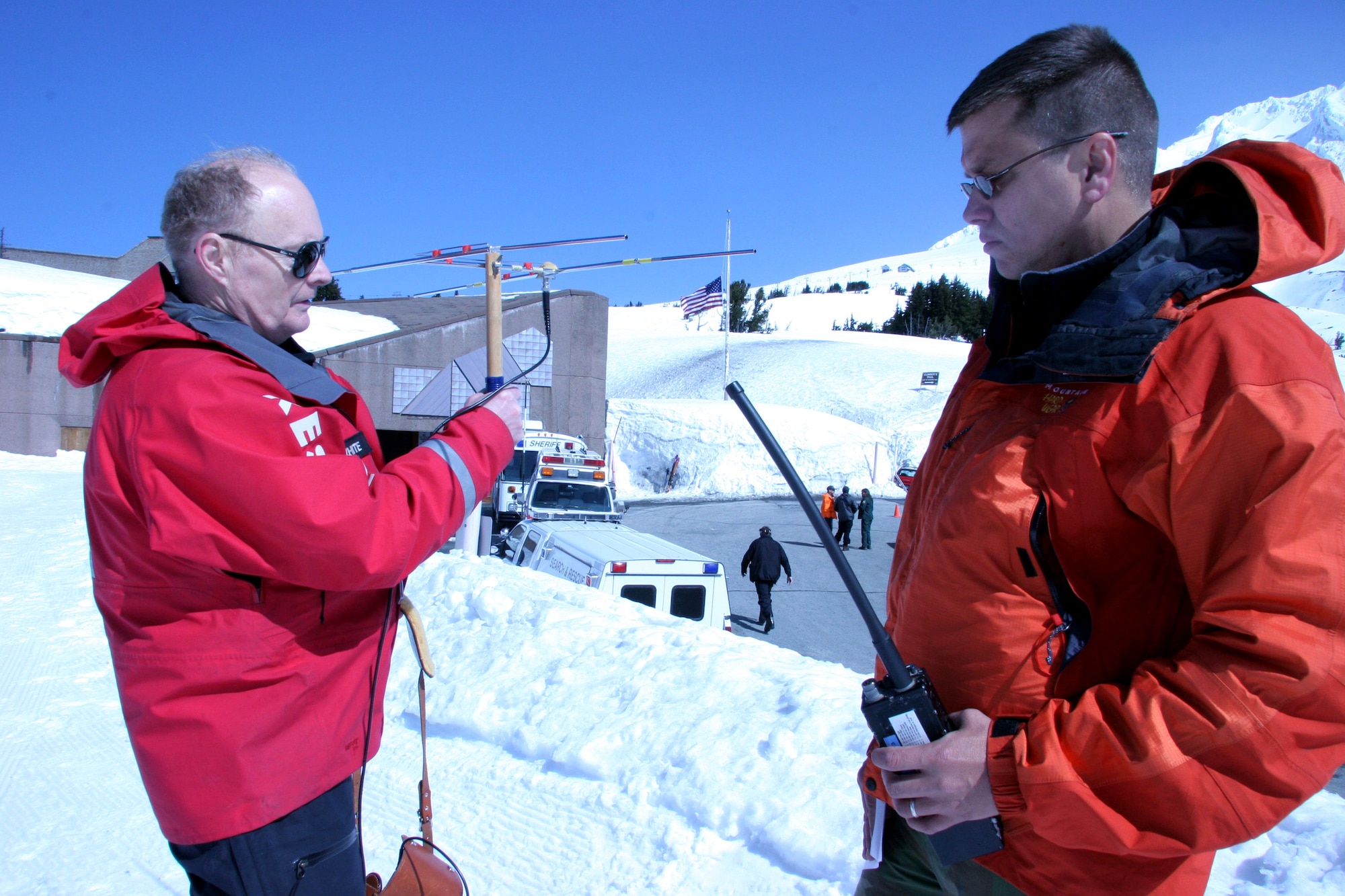 Hal Lillywhite (left) and Capt. Chris Bernard use a directional antenna to track the beacon from mountain locator units worn by "missing" climbers in a search and rescue exercise on Mount Hood, Ore., on Saturday, April 22, 2006. Mr. Lillywhite is a Portland Mountain Rescue volunteer and Captain Bernard is a combat rescue officer with Air Force Reserve Command's 304th Rescue Squadron in Portland, Ore. (U.S. Air Force photo/Ruby Zarzyczny)