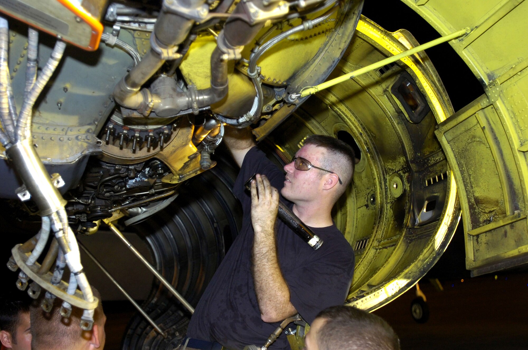Senior Airman Joshua Wortley replaces a generator on a B-52 Stratofortress at a deployed location in Southwest Asia. Airman Wortley, deployed from Barksdale Air Force Base, La., is with the 40th Expeditionary Maintenance Squadron. (U.S. Air Force photo/Senior Master Sgt. John Rohrer) 