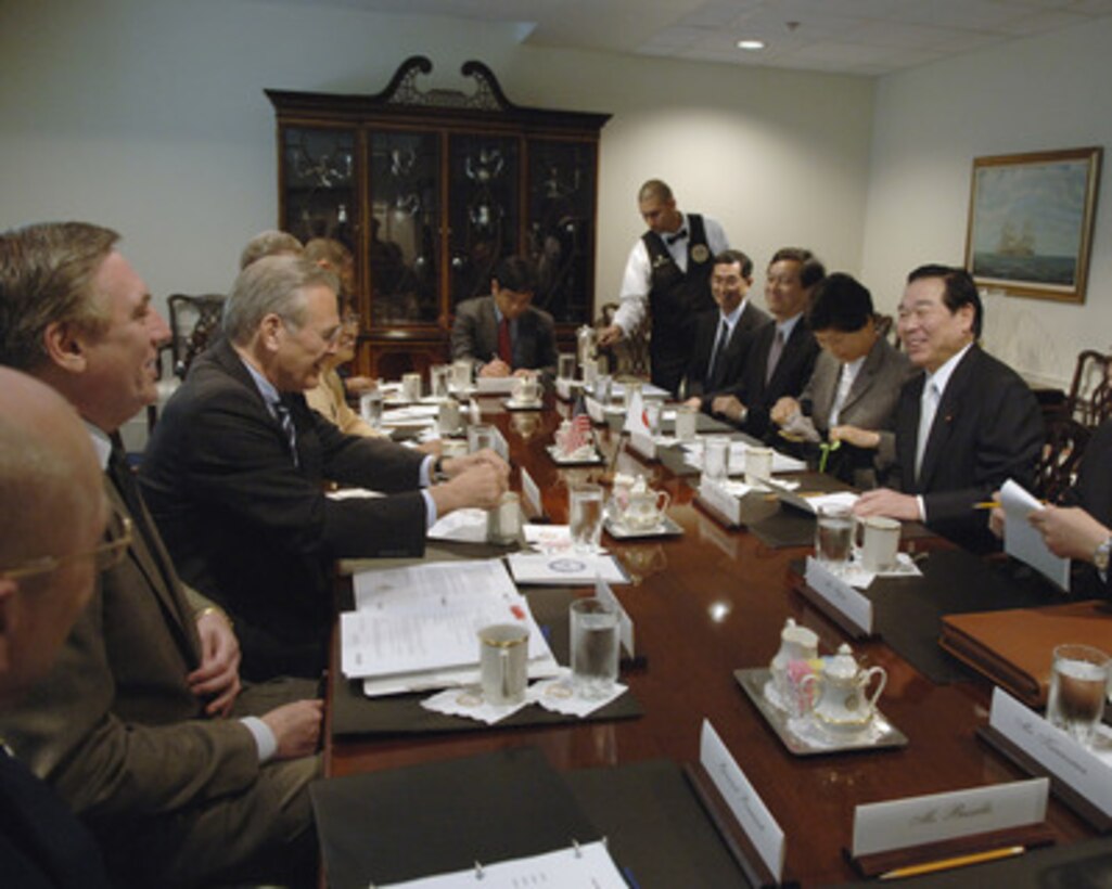 Secretary of Defense Donald H. Rumsfeld (second from left) meets with Japanese Minister of State for Defense Fukushiro Nukaga (right) in the Pentagon on May 3, 2006. Rumsfeld, Nukaga and their senior advisors are discussing defense issues of mutual interest. From left to right: Deputy Under Secretary of Defense for Asia and Pacific Affairs Richard Lawless, Rumsfeld, interpreter, Director of the Japanese Defense Agency Defense Operations Division Atsuo Suzuki, Director of the Japanese Defense Agency Budget and Accounting Division Daikichi Momma, Embassy of Japan Deputy Chief of Mission Akitaka Saiki; interpreter, Nukaga. 