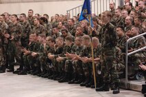 Airmen from the 5th Bomb Wing applaud as they read the names of Minot’s top performers during the Nuclear Operational Readiness Inspection outbrief April 28 at Dock 7 here. (U.S. Air Force photo by Staff Sgt. Joe Laws)