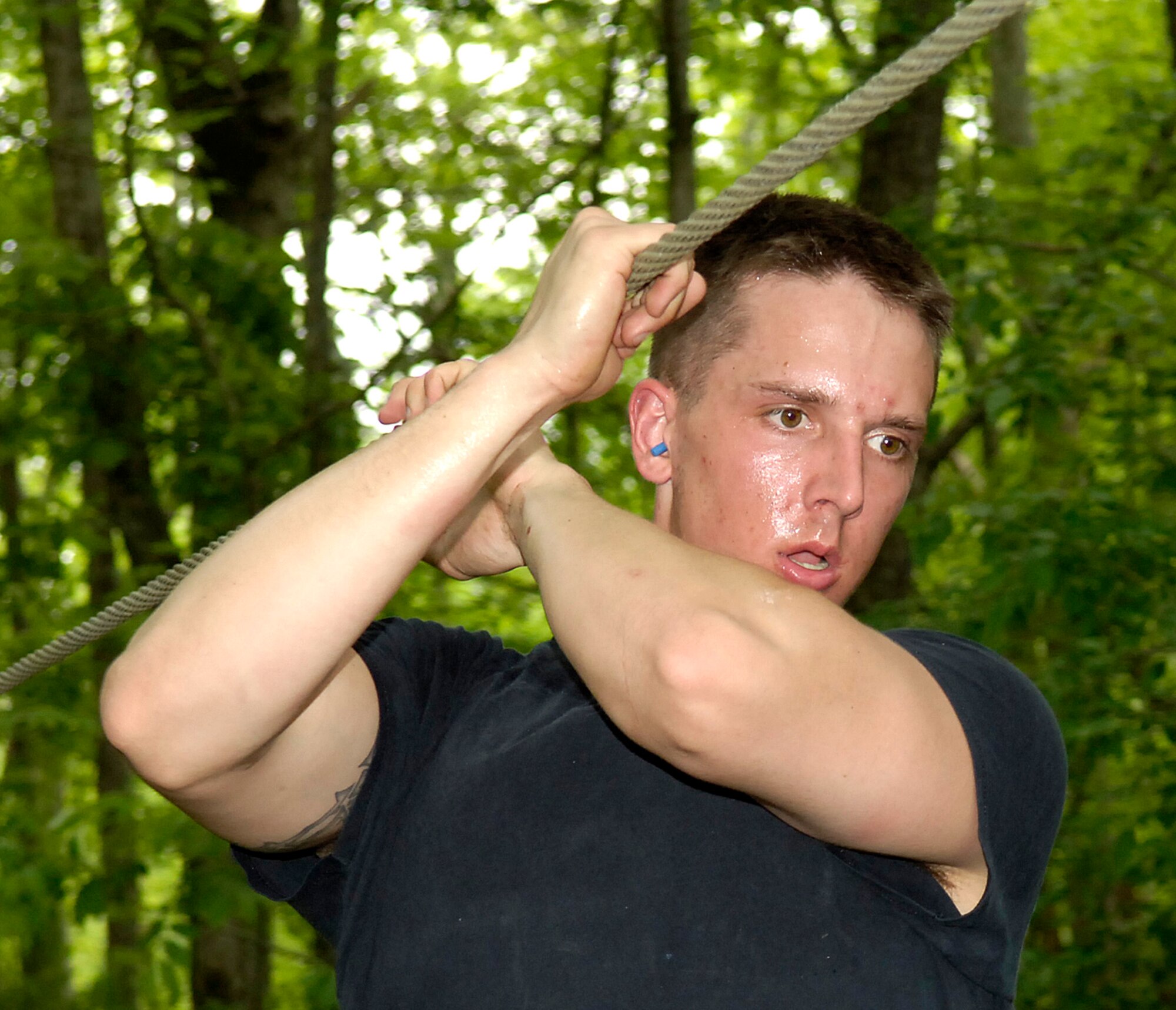 Senior Airman Jason Vavro guides himself across a rope bridge during a timed event at the Louisiana State SWAT Team Competition in Alexandria, La., on Tuesday, May 2, 2006. Airman Vavro is with the 2nd Security Force Squadron at Barksdale Air Force Base, La. (U.S. Air Force photo/Senior Airman Stephen J. Otero) 