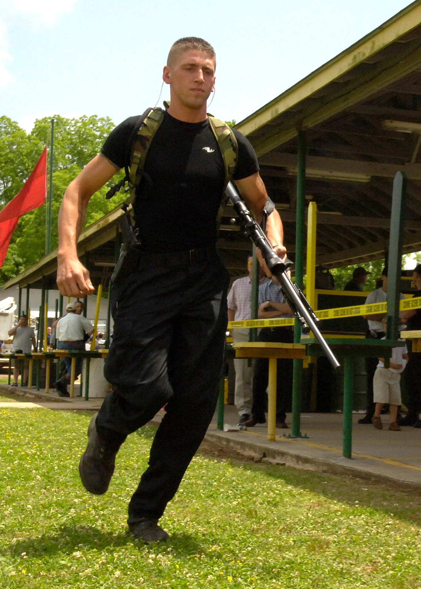 Staff Sgt. Lucas Gutowski proceeds to the sniper event during the Louisiana State SWAT Team Competition in Alexandria, La., on Tuesday, May 2, 2006. Sergeant Gutowski is with the 2nd Security Forces Squadron at Barksdale Air Force Base, La. (U.S. Air Force photo/Senior Airman Stephen J. Otero)