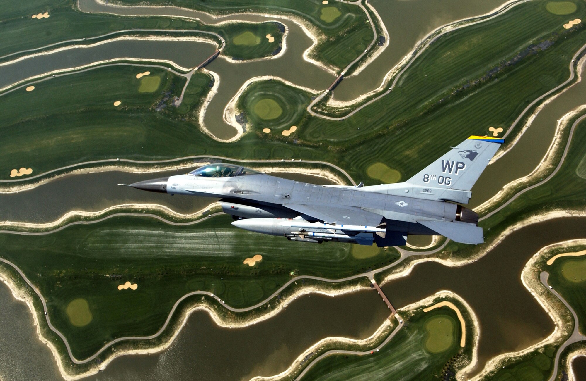 An F-16 Fighting Falcon from the 8th Fighter Wing at Kunsan Air Base, South Korea, flies near the base on Friday, April 28, 2006. The F-16 was flown by Col. Eric Best, 8th Operations Group commander. (U.S. Air Force photo/Master Sgt. Richard Freeland) 
