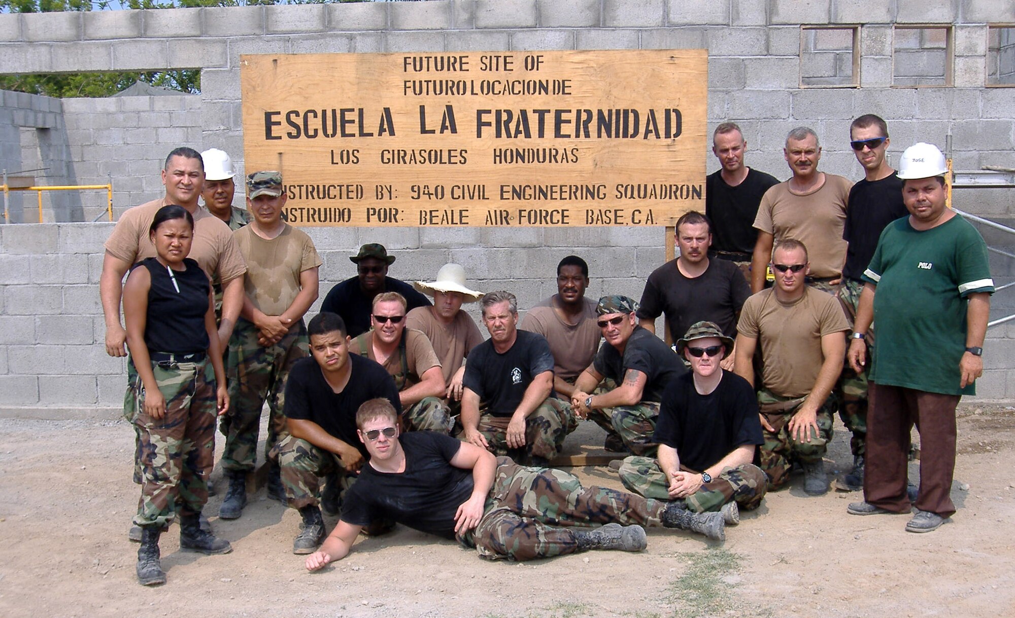 Air Force Reservists from the 940th Civil Engineer Squadron, Beale Air Force Base, Calif., pose in front of a school they are building in La Ceiba, Honduras March 20, 2006.  940 CES is part of Combined Joint Task Force New Horizons 2006 in Honduras. (U.S. Air Force photo/Capt. Rudolph Bartley)