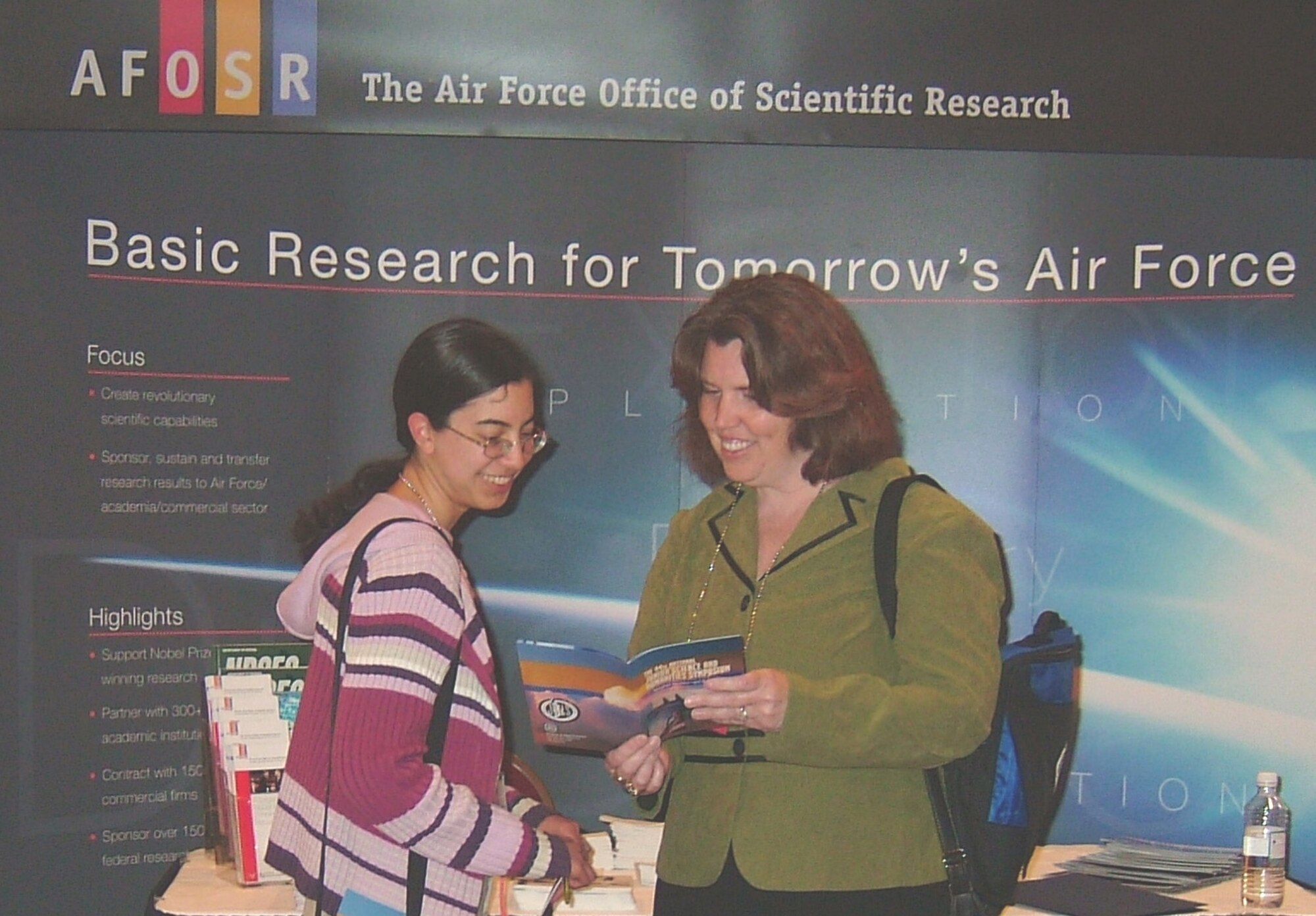 Dr. Kathleen Kaplan, Program Manager, External Programs & Resources Interface, Air Force Office of Scientific Research (AFOSR), discusses AFOSR's grant portfolio for graduate and post graduate students with a student attendee at the 44th National Junior Science and Humanities Symposium held April 26-29 in Albuquerque, N.M. (Air Force photo by Erin Crawley)
