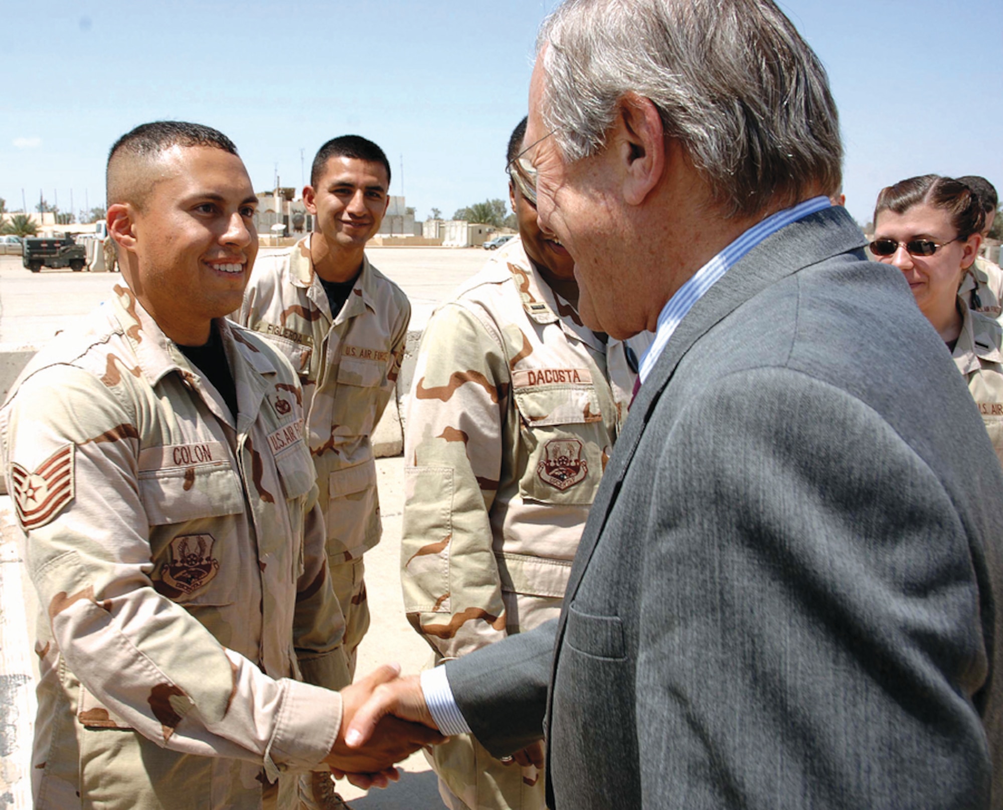 CANNON AIR FORCE BASE, N.M. - Secretary of Defense Donald Rumsfeld greets Tech. Sgt. David Colon, 447th Expeditionary Security Forces Squadron, at Sather Air Base, Iraq, April 27. The sergeant is deployed from  Cannon where he is assigned to 27th Security Forces Squadron. (U.S. Air Force photo by Master Sgt. Will Ackerman)